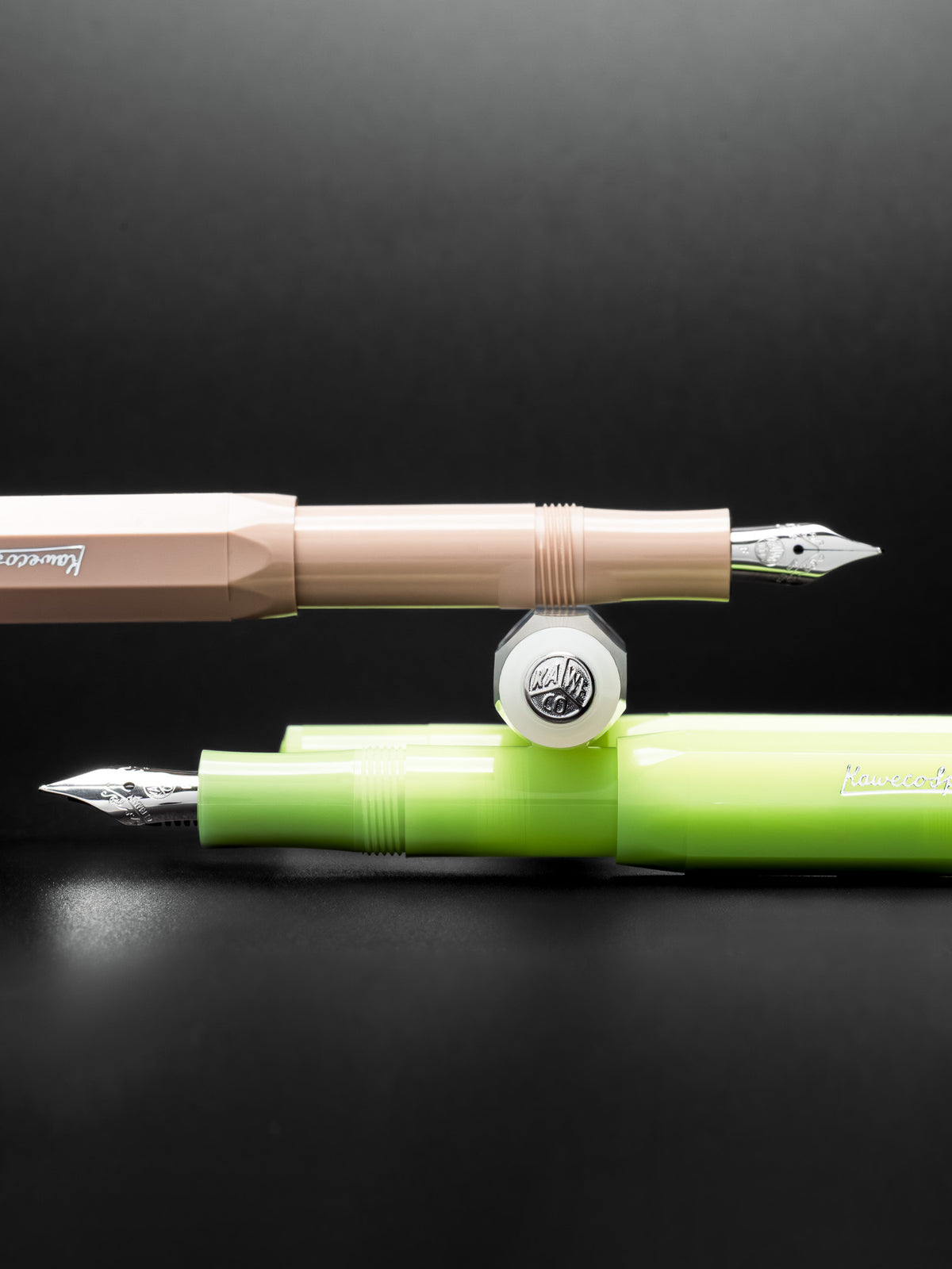 Kaweco Fountain Pens in beige, white, and lime green.