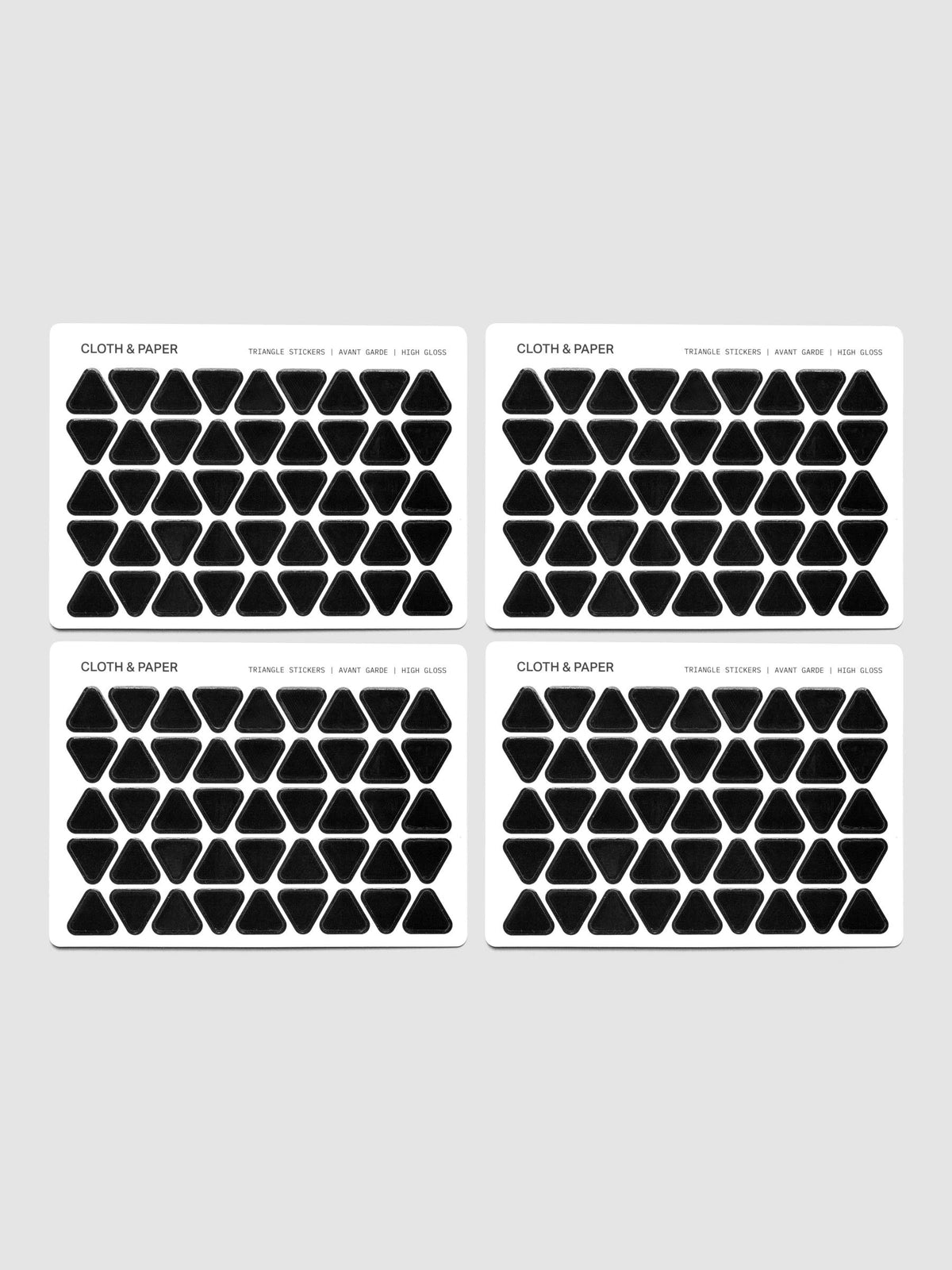 Four sheets of high gloss, black triangle stickers