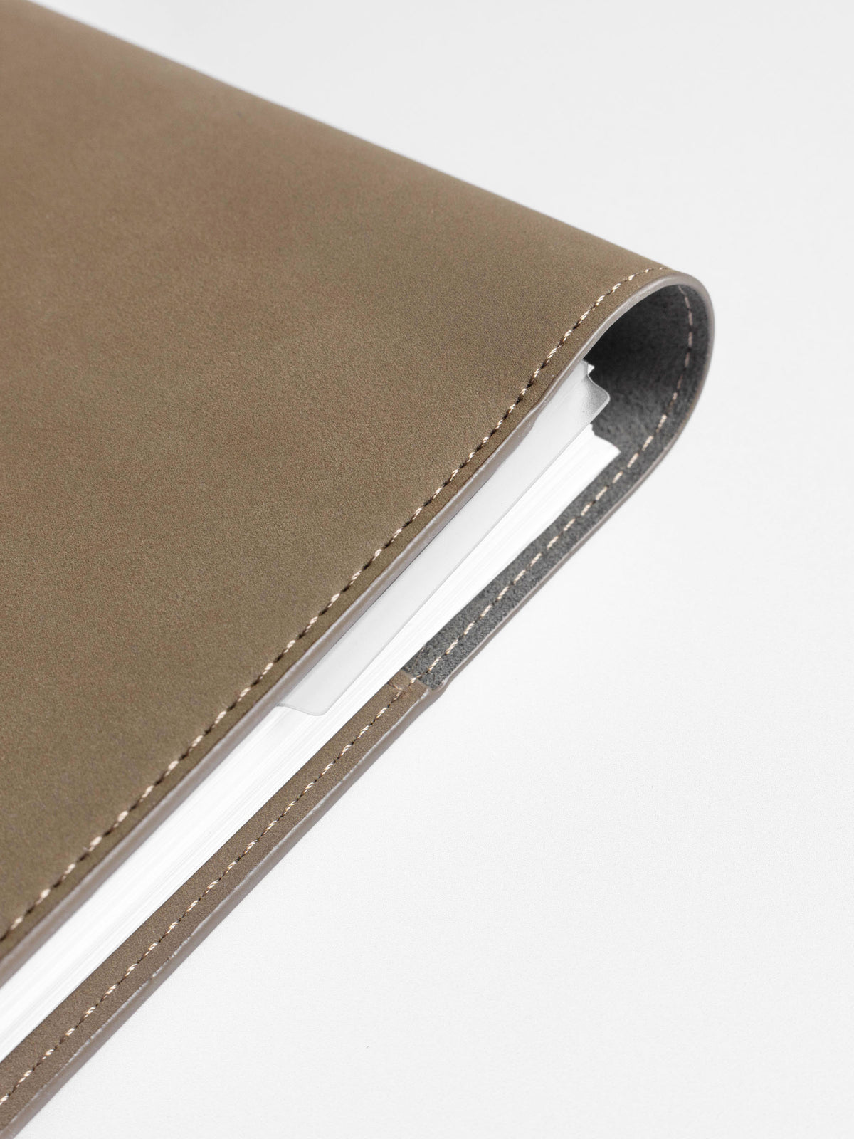 Page marker shown protruding from a discbound planner.
