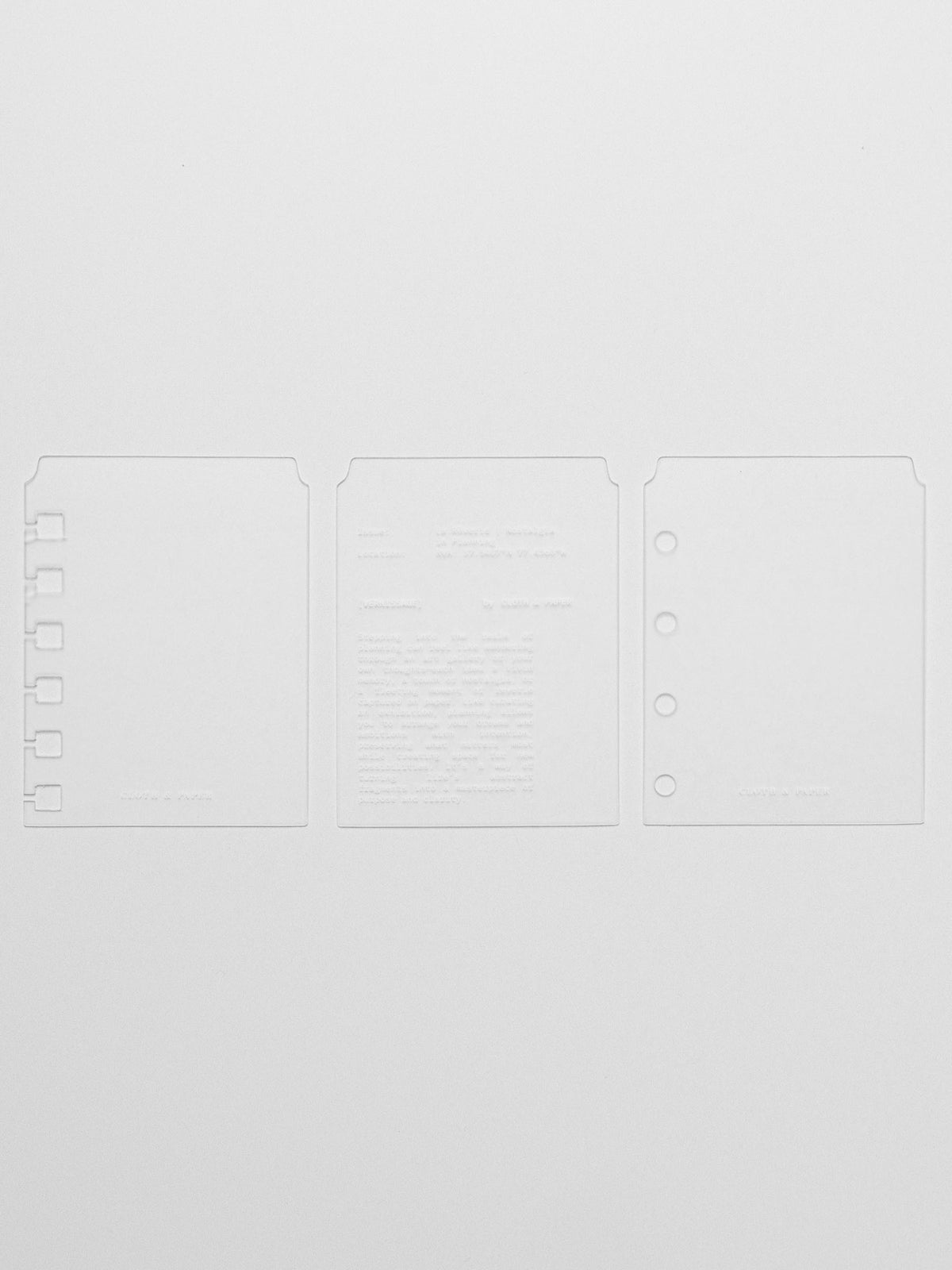 Set of three page markers including spiral punch, unpunched, and hole punched for ring bound planners.