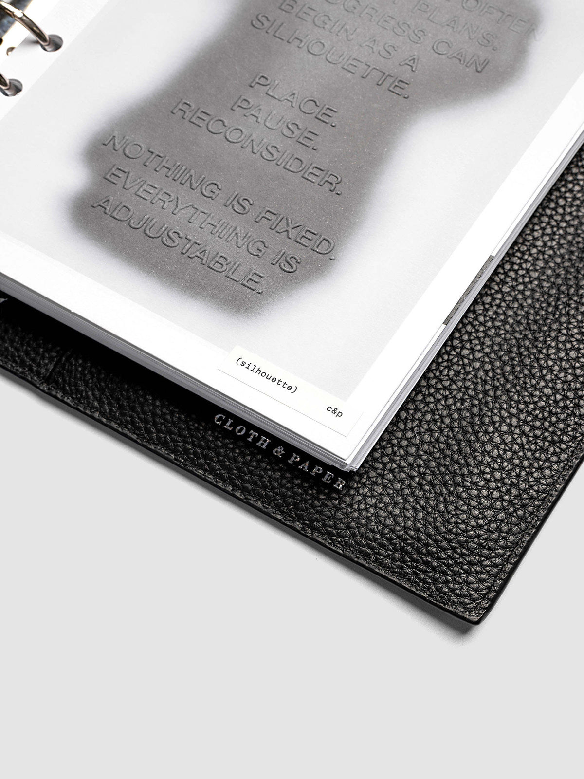 Silhouette Planner Dashboard in A5 6-Ring Punch. Greyscale silhouette print with embossed text on paper. Image 3 of 4.