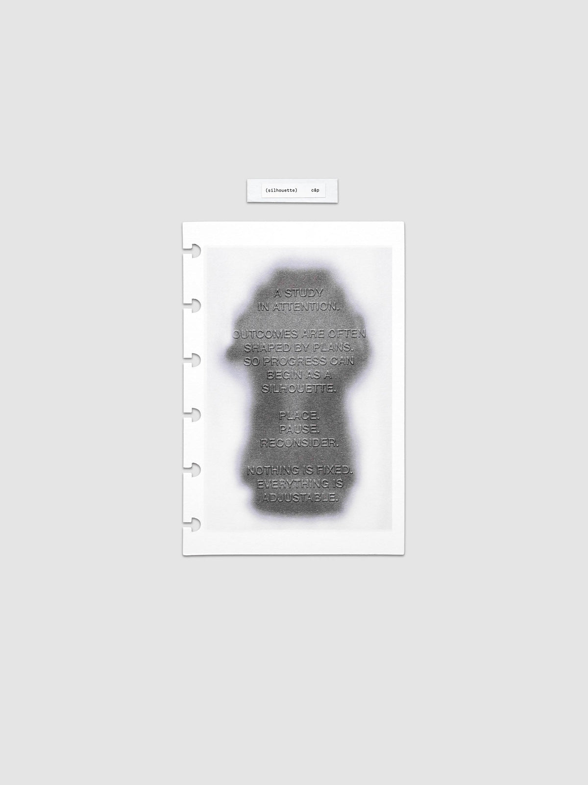 Silhouette Planner Dashboard in CP Petite. Greyscale silhouette print with embossed text on paper. Image 1 of 2.