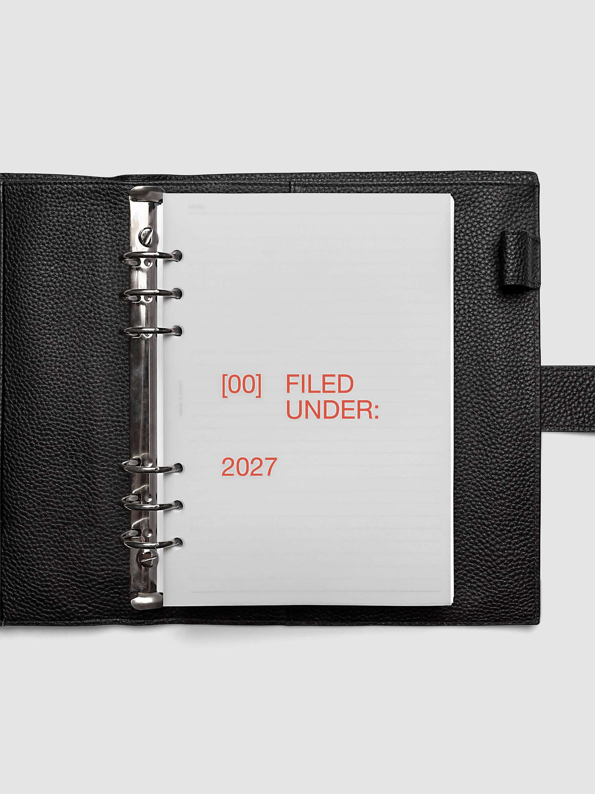 2027 Front + Monthly Dashboard Overlays, Saffron, A5 6-Ring Punch, vellum dashboard overlay shown layered inside a planner
