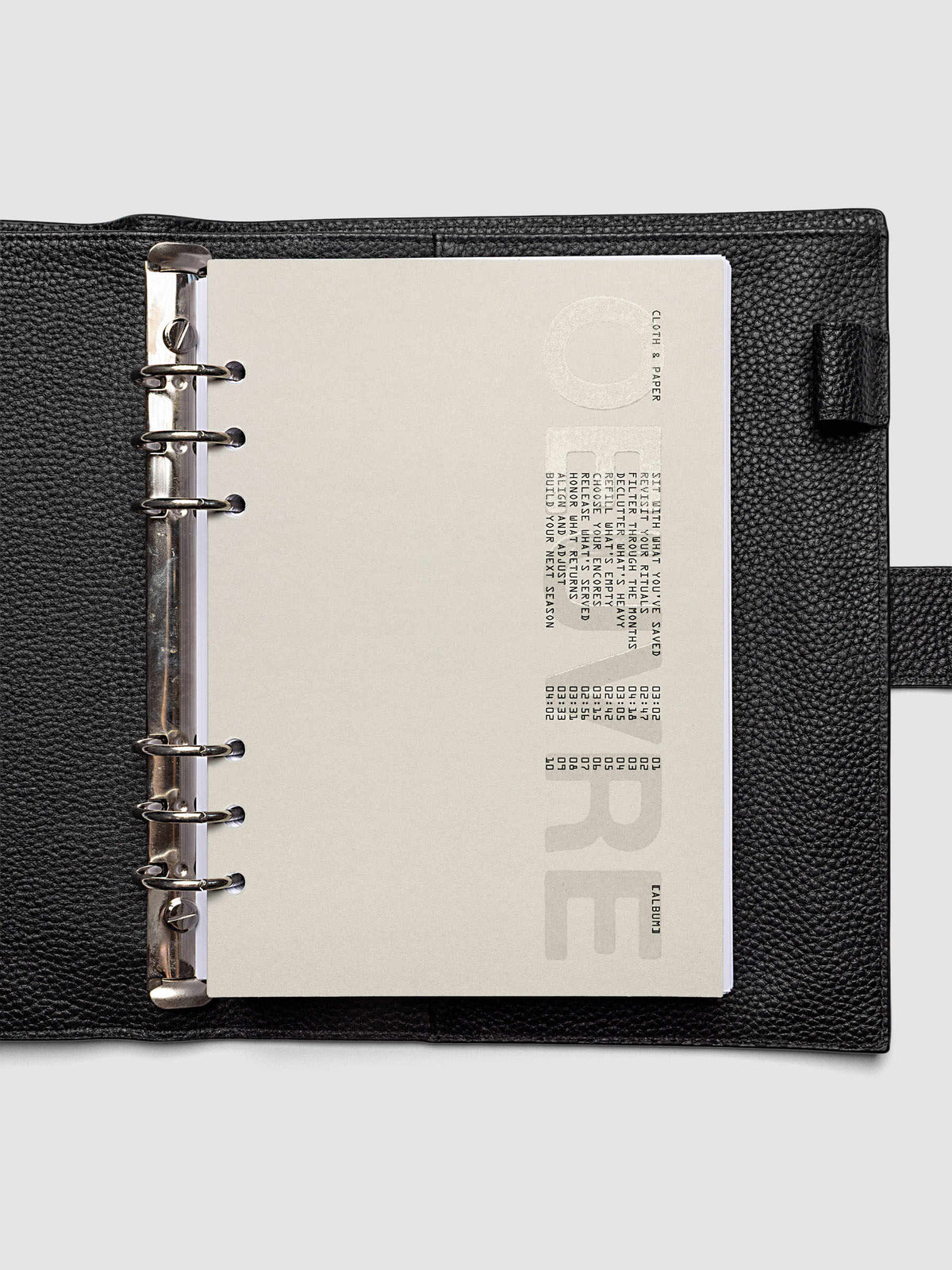 Oeuvre Planner Dashboard in A5 6-Ring Punch size shown in a planner