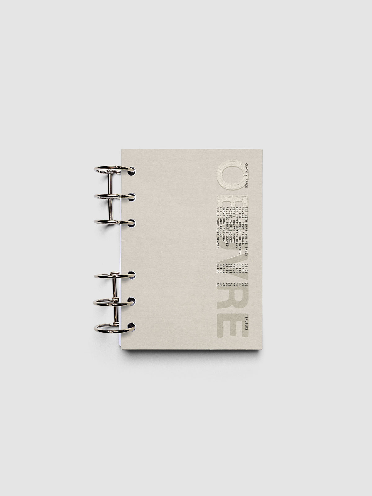 Oeuvre Planner Dashboard in A6 6-Ring Punch size shown in a planner