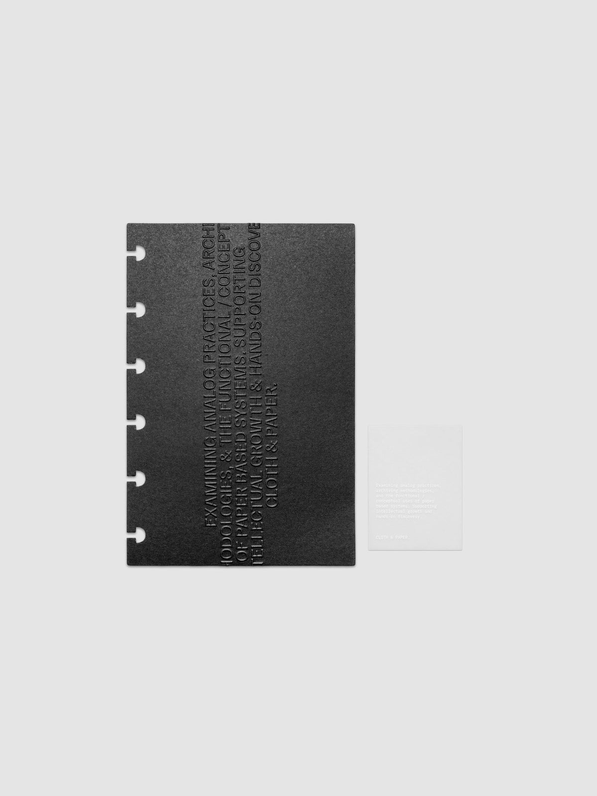 Black embossed Analog Embossed Planner Dashboard with drop card shown in size CP Petite.