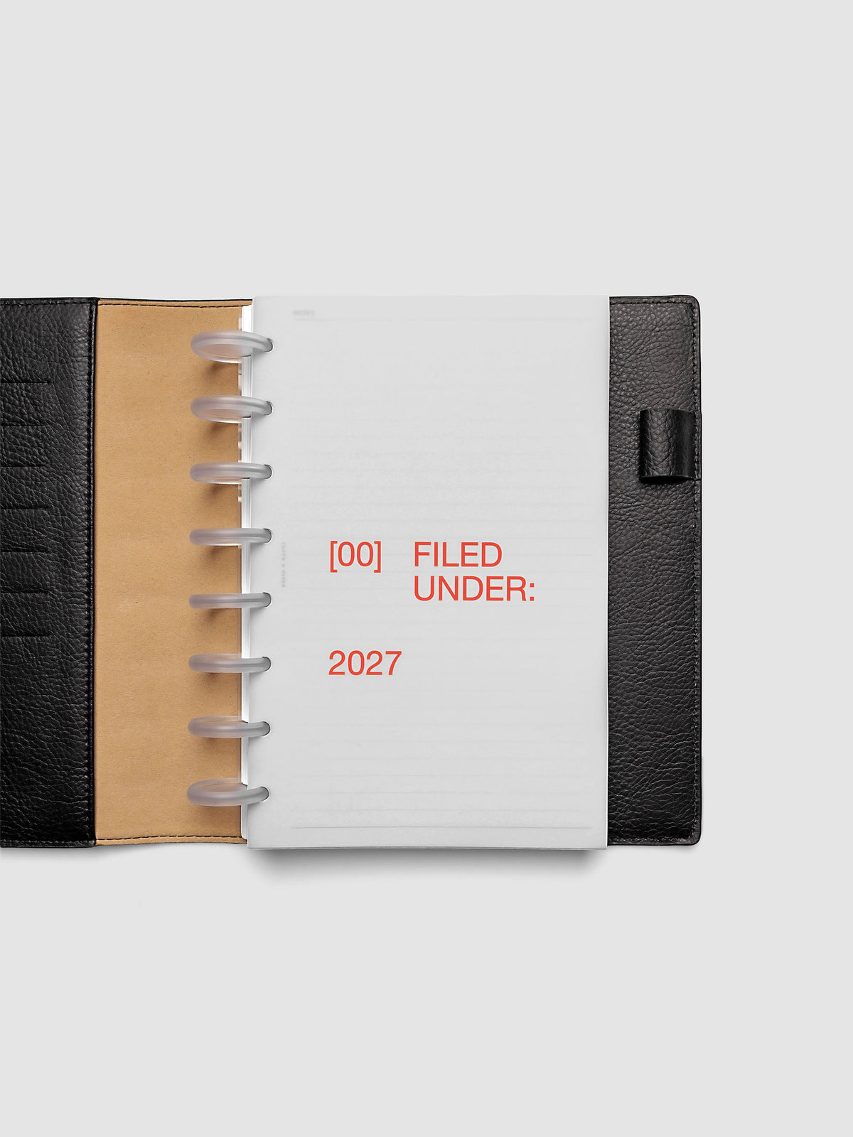 2027 Front + Monthly Dashboard Overlays, Saffron, Half Letter 8-Disc Punch, vellum dashboard overlay shown layered inside a planner