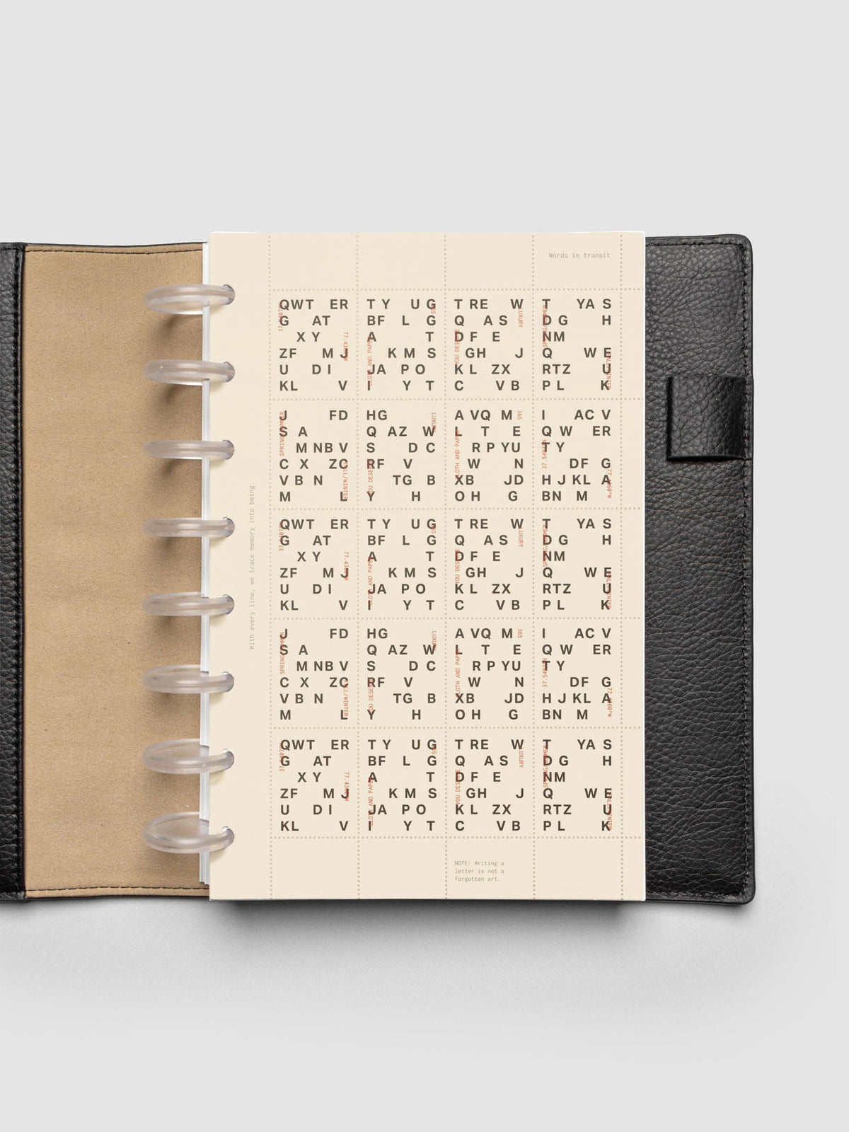 Stamp Sheet Planner Dashboard shown in a Half Letter black leather folio.