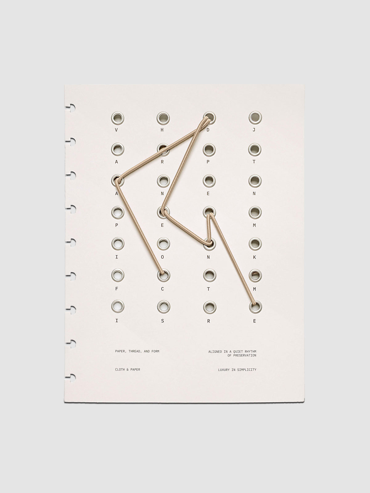Cadence Dashboard with grommets and string on beige cardstock shown in size HP Classic for discbound planners and notebooks.