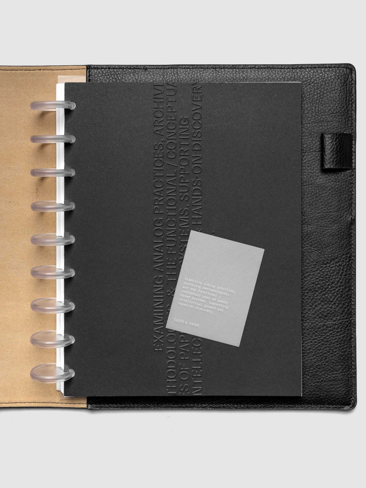 Black embossed Analog Embossed Planner Dashboard with drop card shown in size HP Classic 9-Disc Punch.