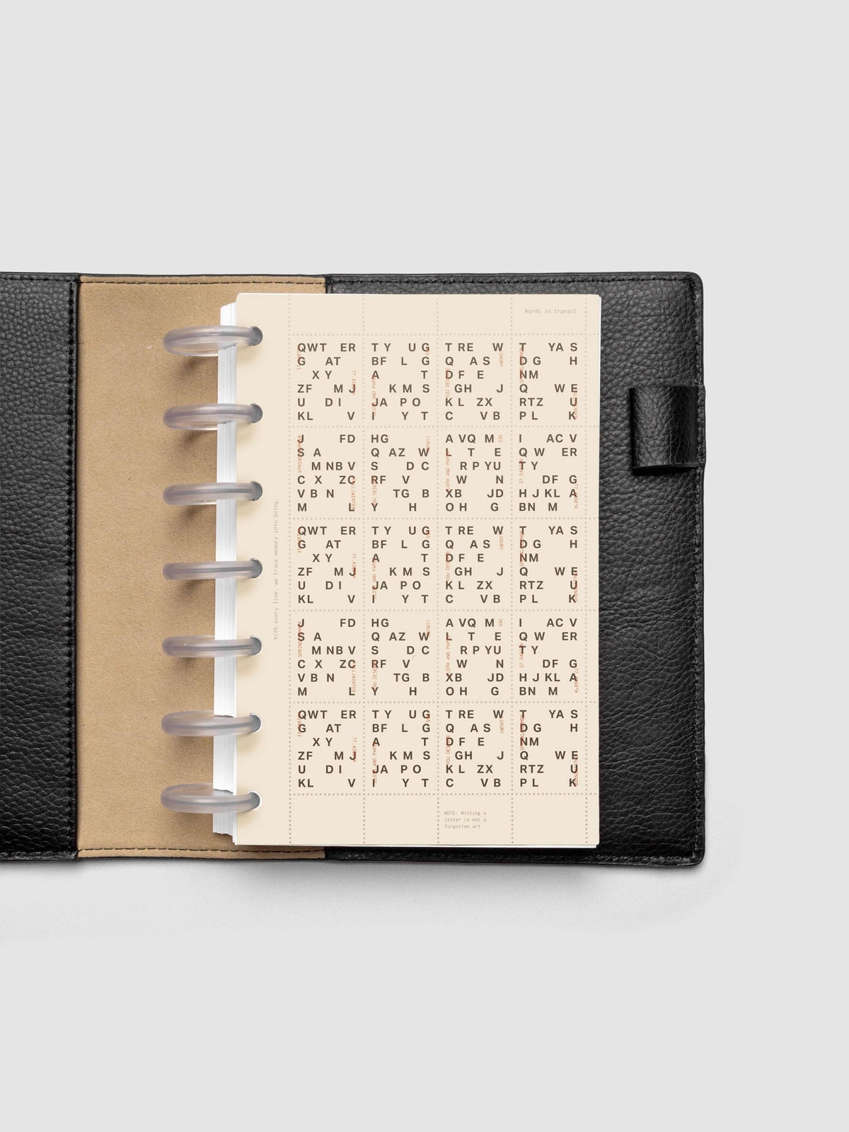 Stamp Sheet Planner Dashboard shown in a HP Mini black leather folio.