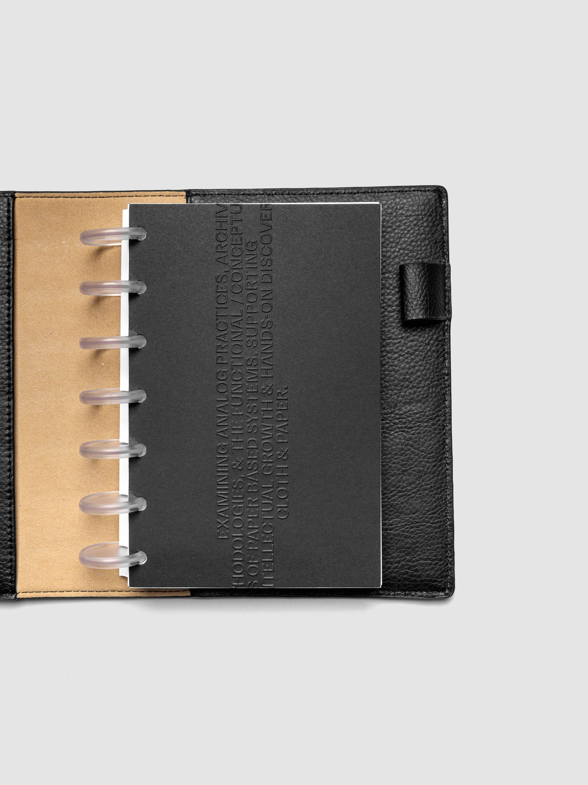 Black embossed Analog Embossed Planner Dashboard without the drop card shown in size HP Mini.