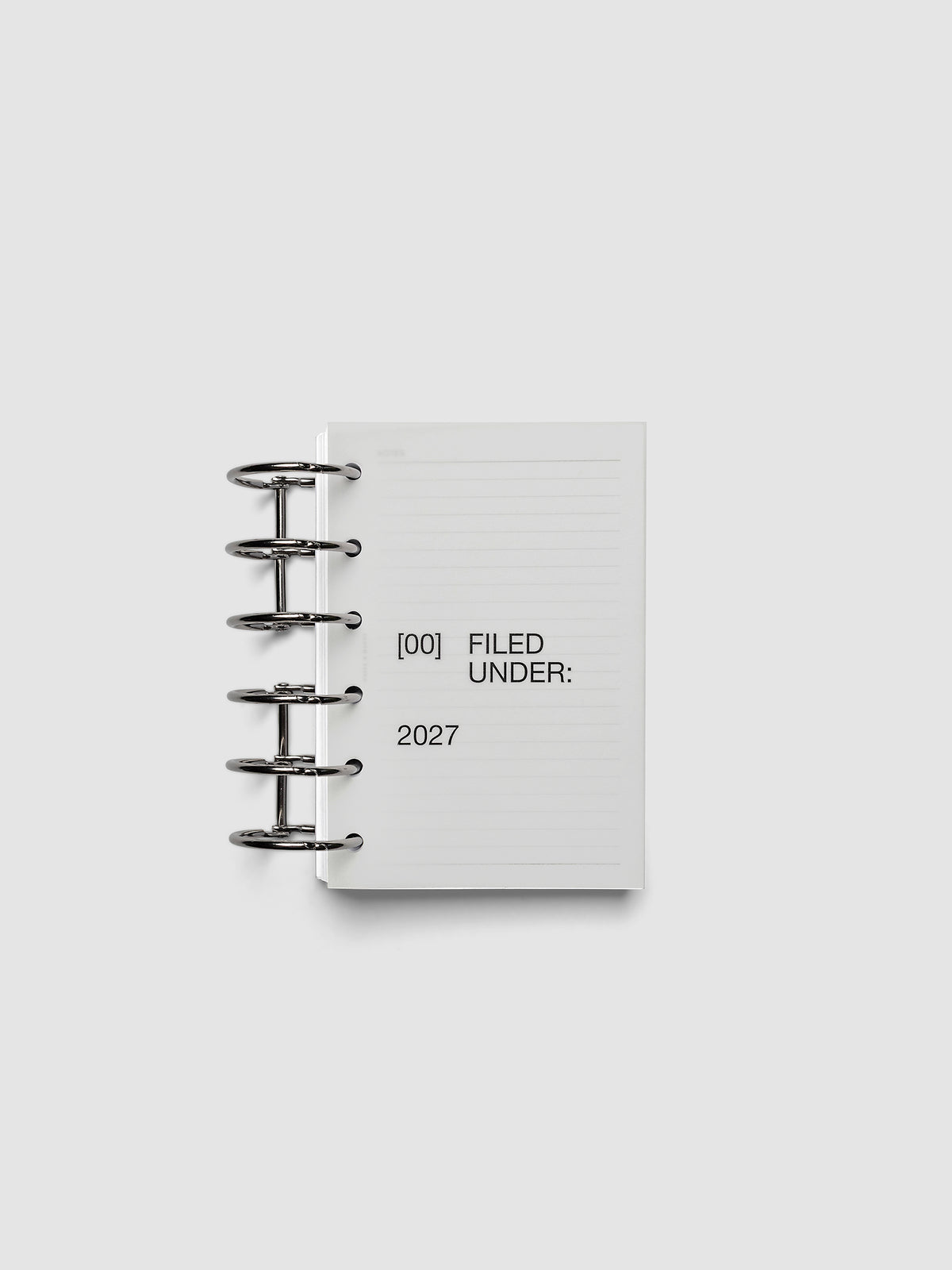 2027 Front + Monthly Dashboard Overlays, Avant Garde, Pocket 6-Ring Punch, vellum dashboard overlay shown layered inside a planner