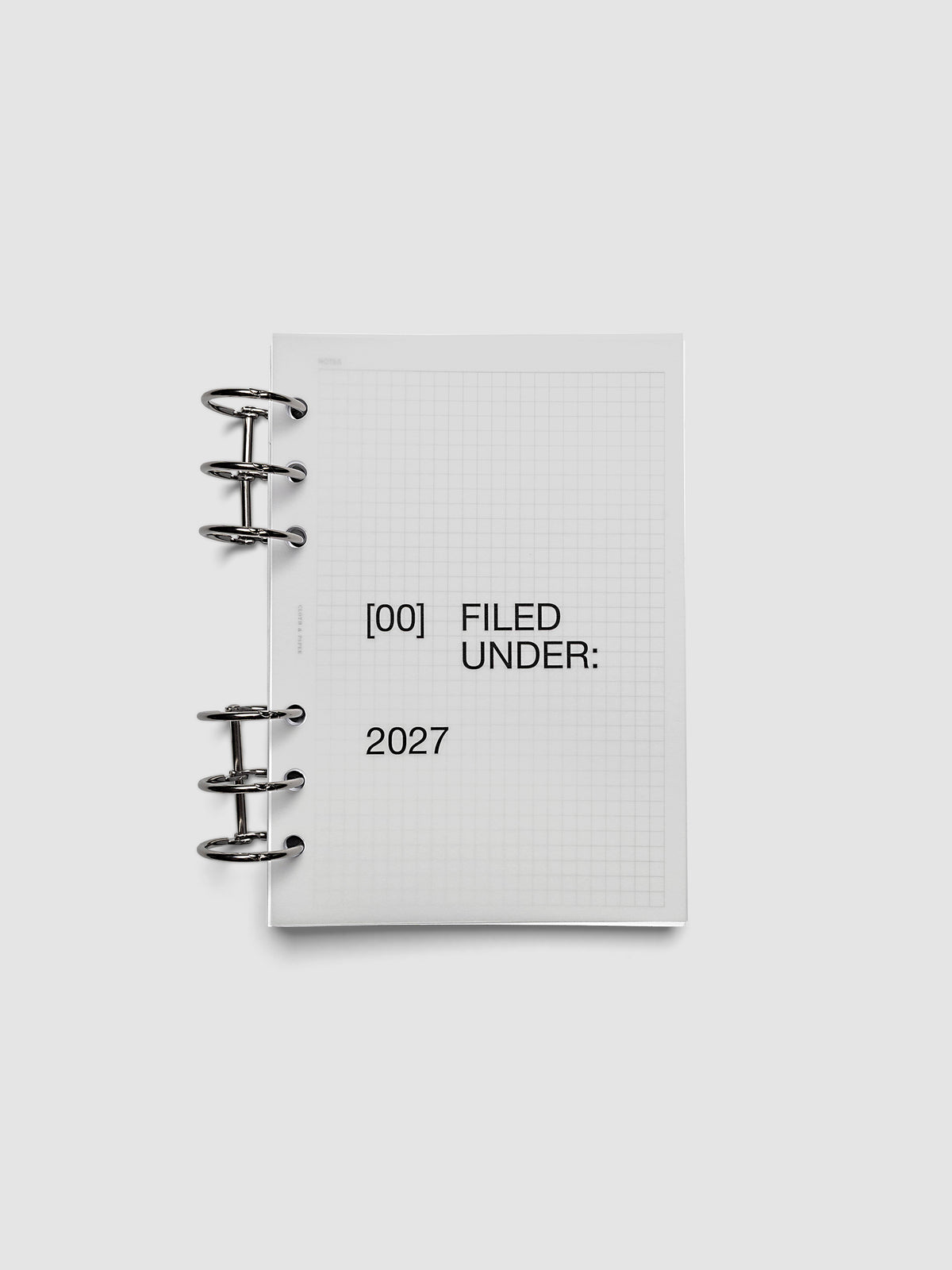 2027 Front + Monthly Dashboard Overlays, Avant Garde, Personal Wide 6-Ring Punch, vellum dashboard overlay shown layered inside a planner