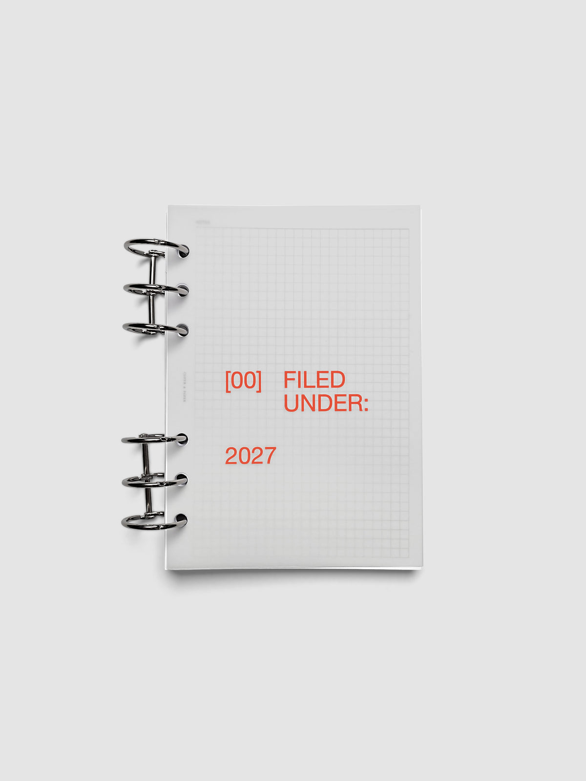 2027 Front + Monthly Dashboard Overlays, Saffron, Personal Wide 6-Ring Punch, vellum dashboard overlay shown layered inside a planner