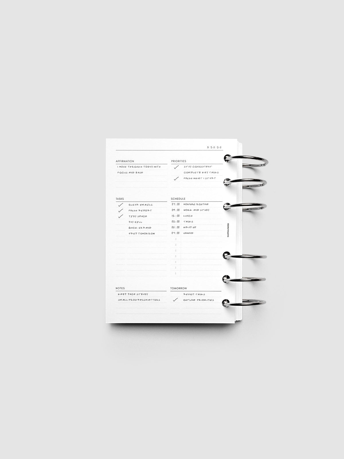 Demo page for the Daily Essentials Planner Inserts shown ring bound in size A6.