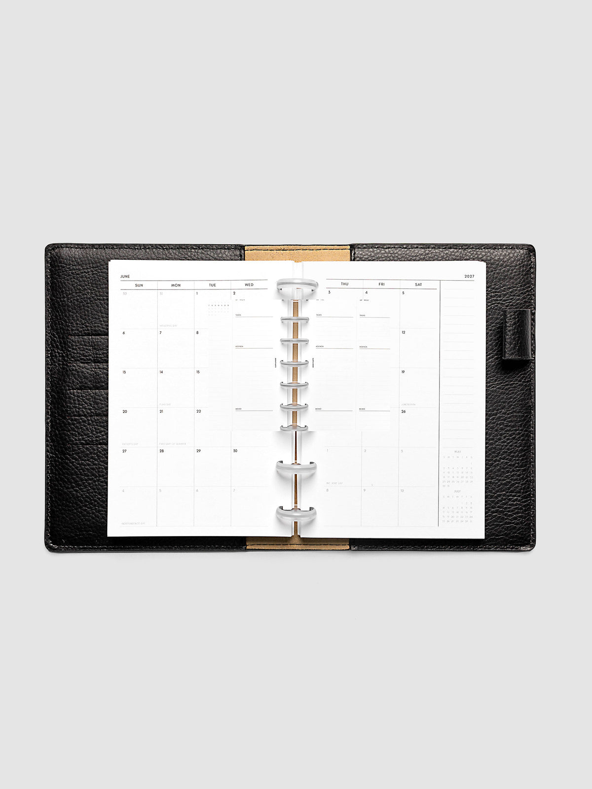 Open planner showing the full two-page 2027 Dated Monthly Sunday Start spread in CP Petite 6-Disc Punch size, with calendar grid, notes column, and mini calendars in the bottom right corner