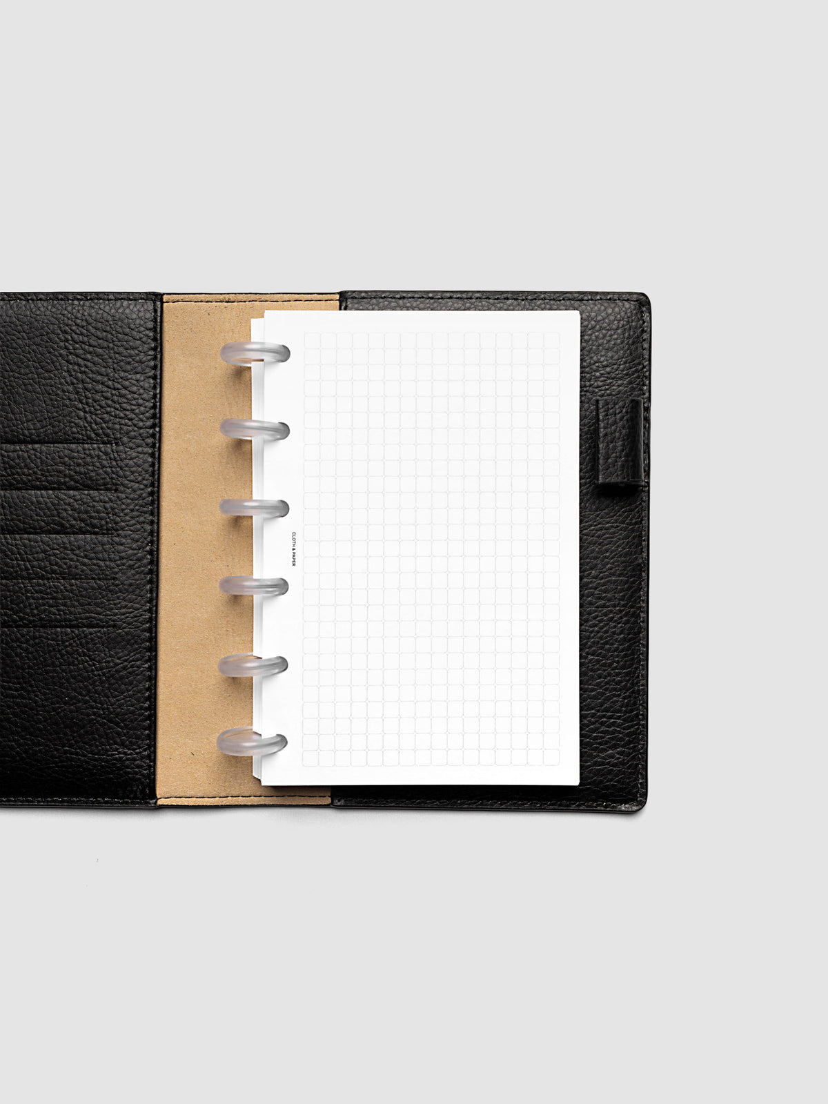 Rounded Graph Planner Insert CP Petite 6-Disc Punch open to an unused grid page