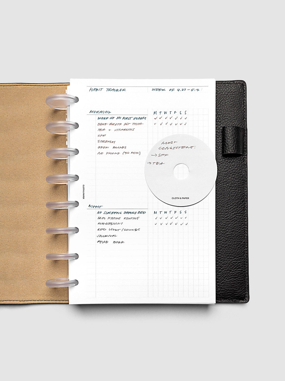 Daily Workflow Planner Inserts, Half Letter 8-Disc Punch, right page with handwritten notes filling the large graph section shown inside a planner