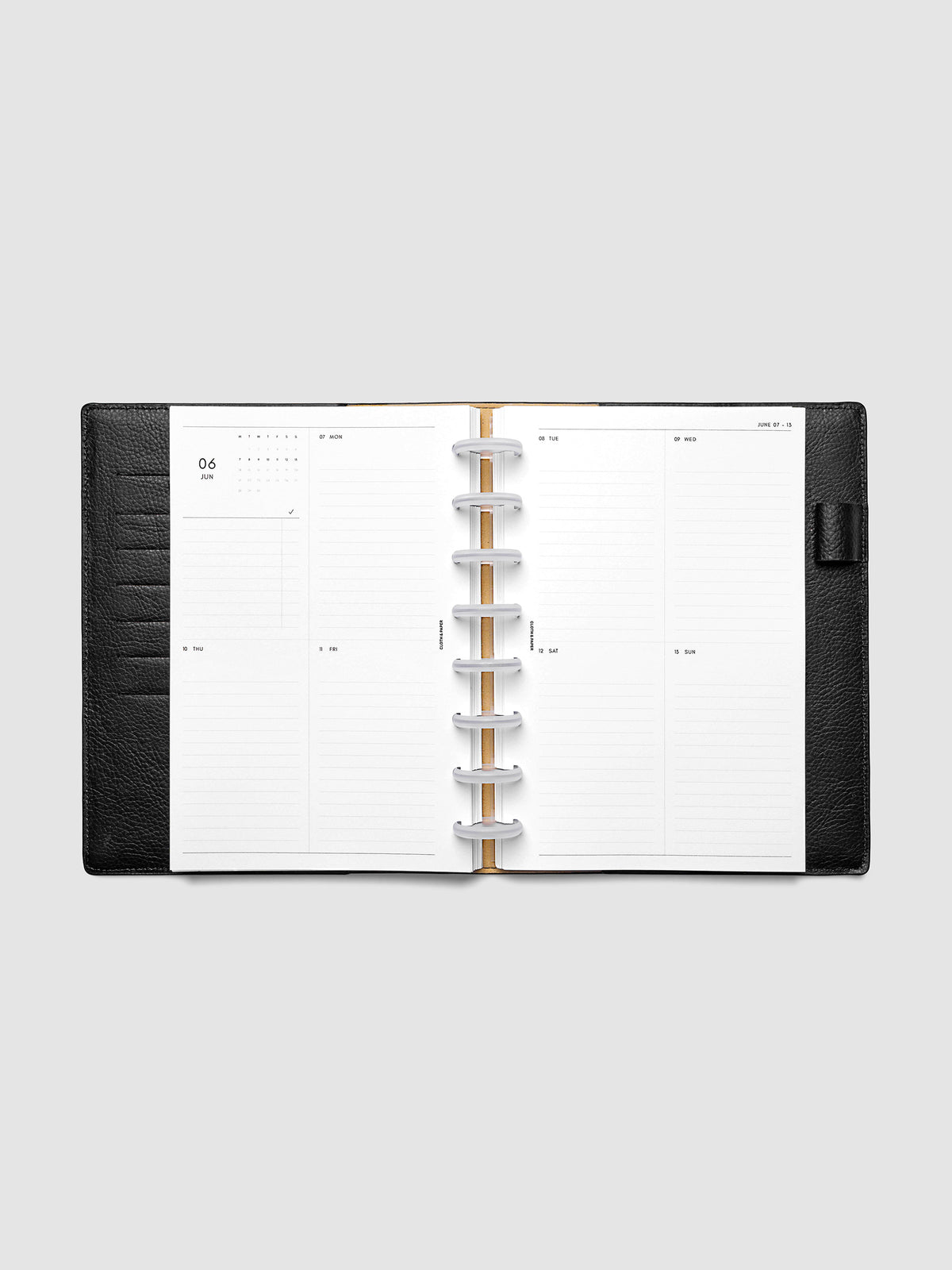 Both pages inside planner: 2027 Dated Weekly Vertical Planner Inserts, Monday Start, Half Letter 8-Disc Punch, full week-on-two-pages spread showing a two-column two-row daily grid with lined sections, mini monthly calendar and task list in the top left, shown inside a planner