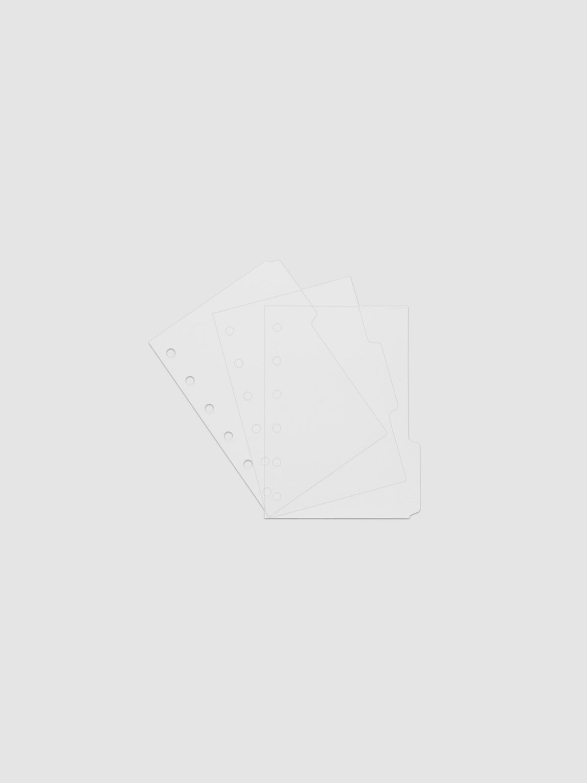 Three 6-ring punch clear side tab dividers sized for Pocket planners.