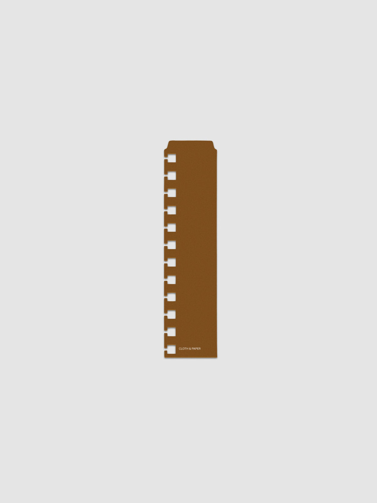 One narrow page marker in brown, shown in size CP Petite Spiral.