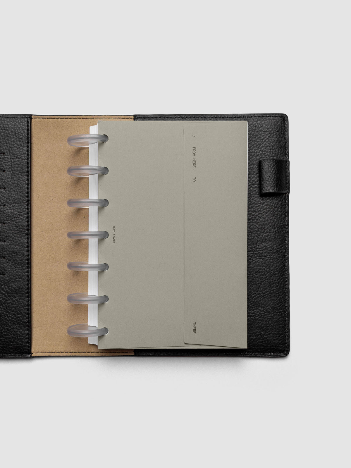 Beige Envelope Storage Holder shown inside a black, leather HP Mini folio.