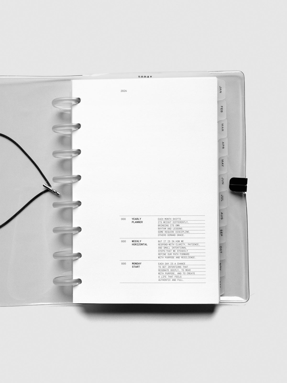 2026 Dated Planner Bundle Horizontal Weekly Monday Start in size Half Letter shown open to the front page inside of a Clear Vinyl Planner Cover.