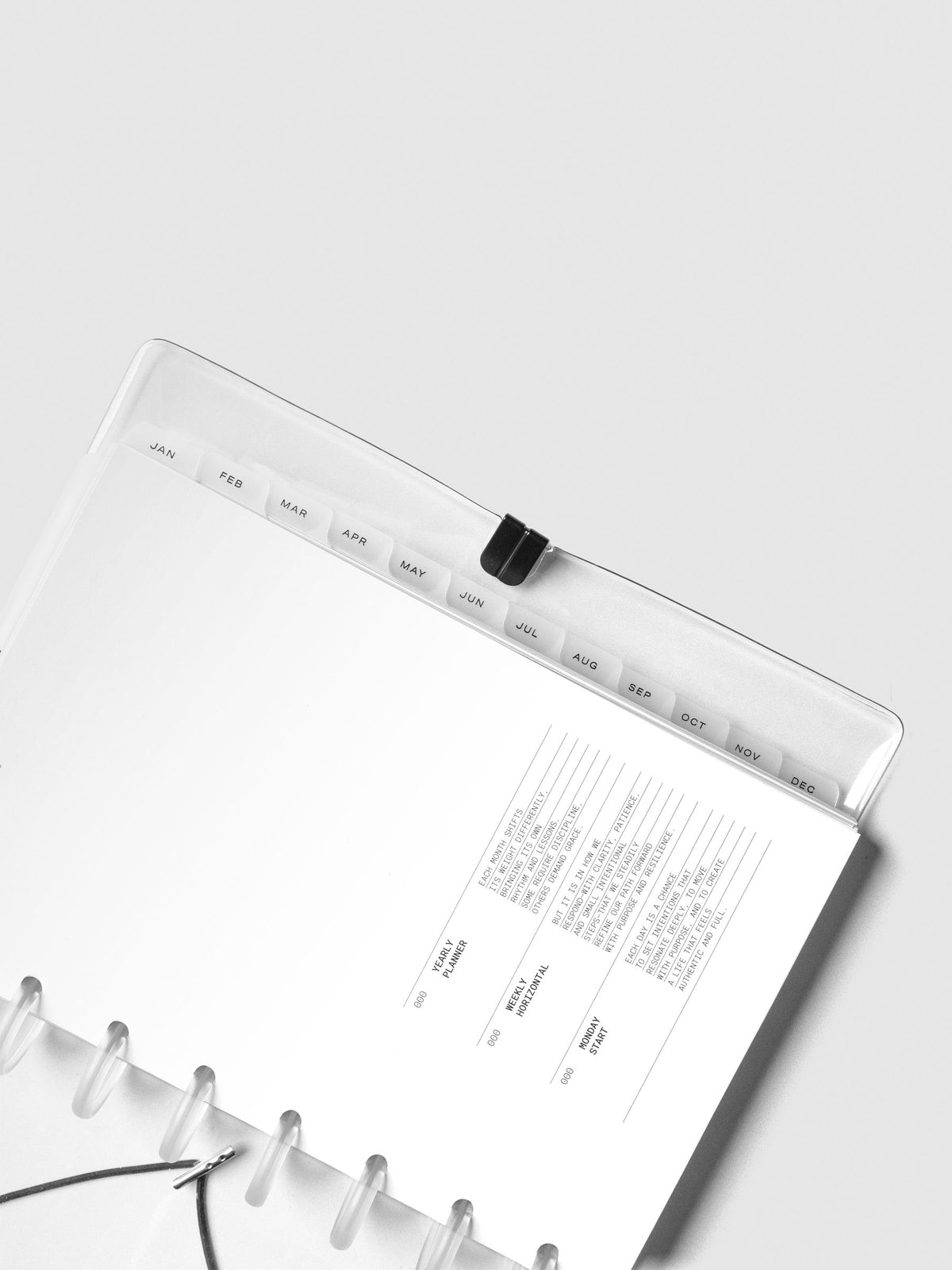 Close up of monthly side tab dividers included with the 2026 Dated Planner Bundle Horizontal Weekly Monday Start in size Half Letter.