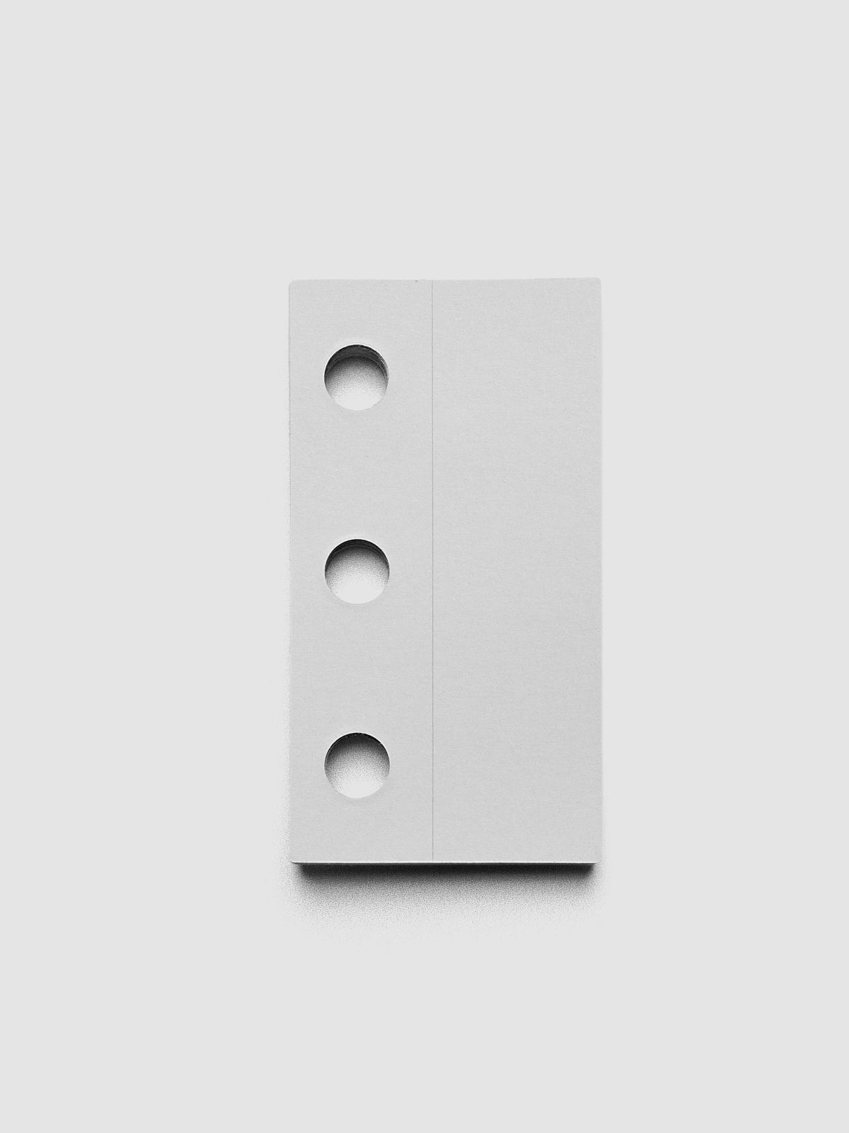 Single ring system punch sticker against a grey background.