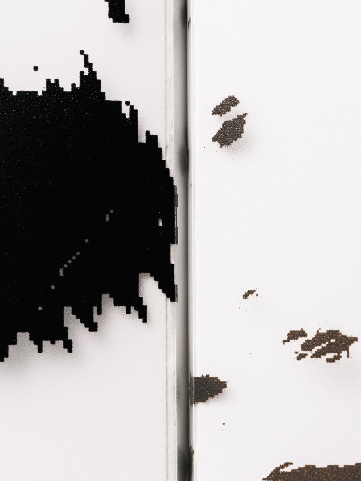 Close-up of two frosted plastic notebook covers featuring a dalmatian animal print pattern in black and brown