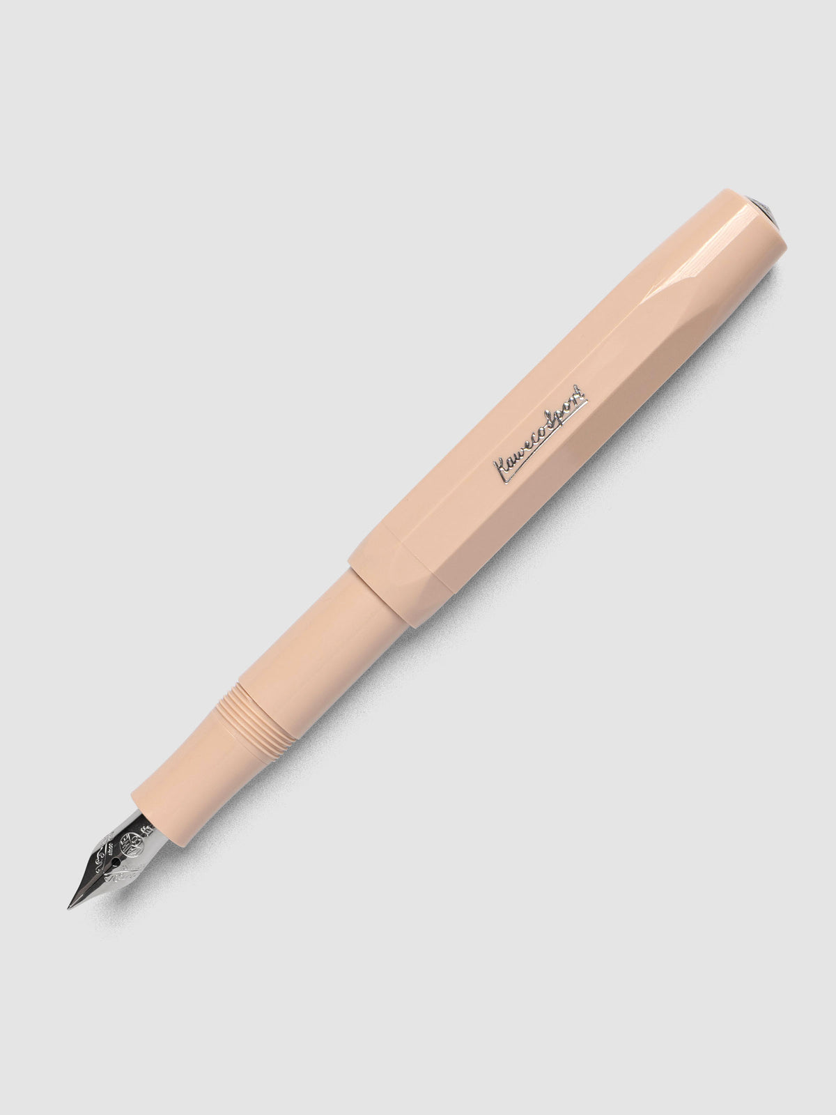 Warm beige fountain pen with an extra fine nib shown with cap posted.