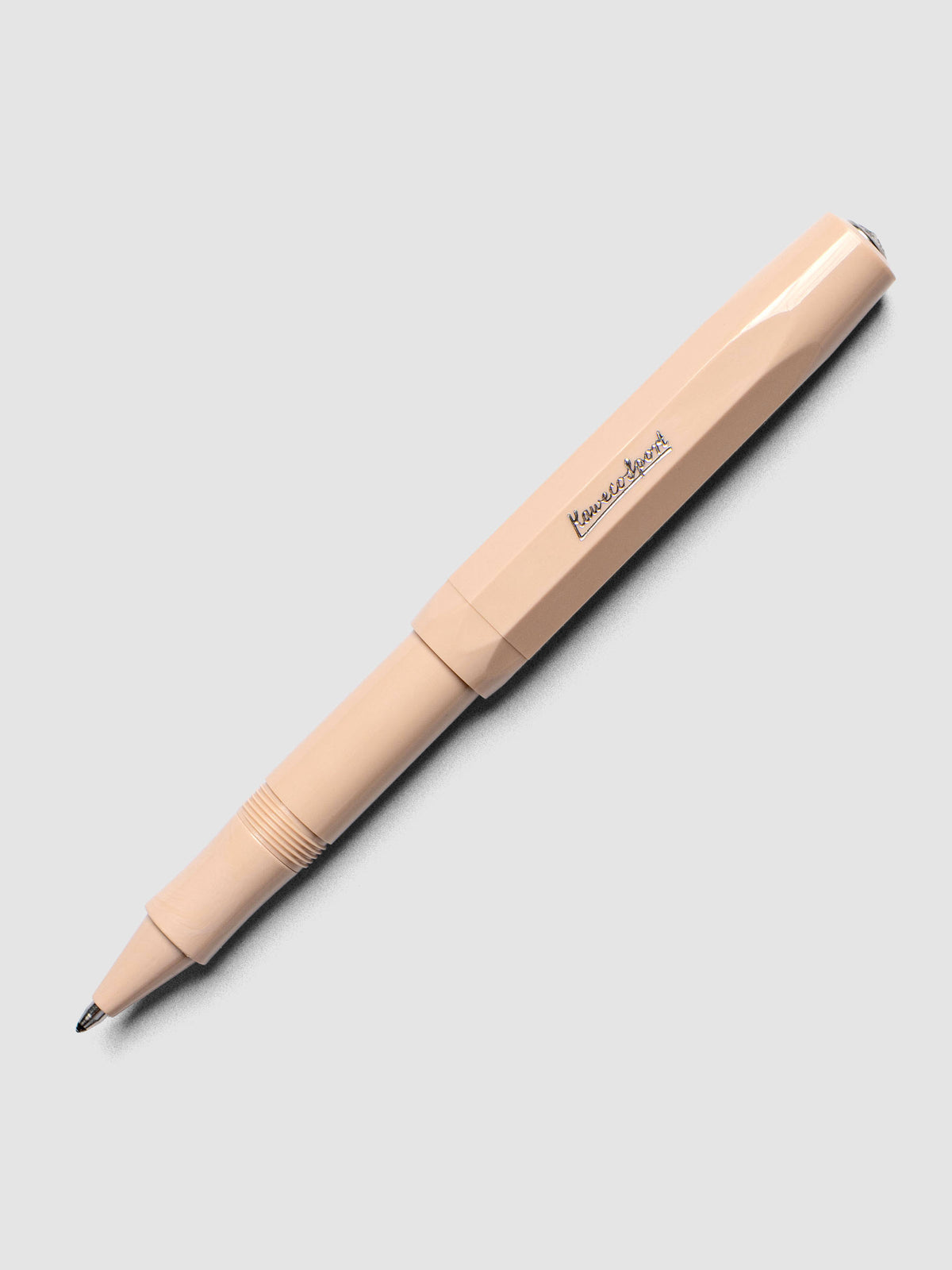 Warm beige rollerball pen shown with cap posted.