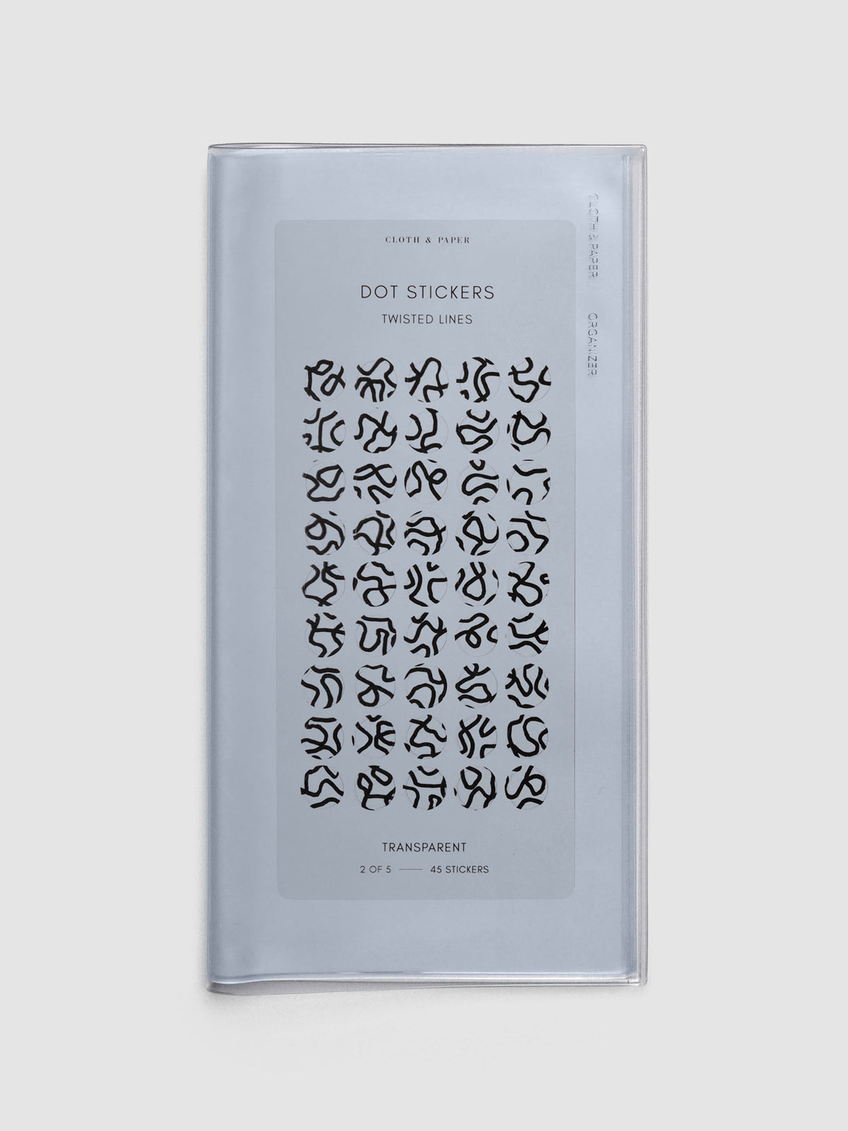A5 Slim sized clear travel organizer with a sheet of dot stickers inside.