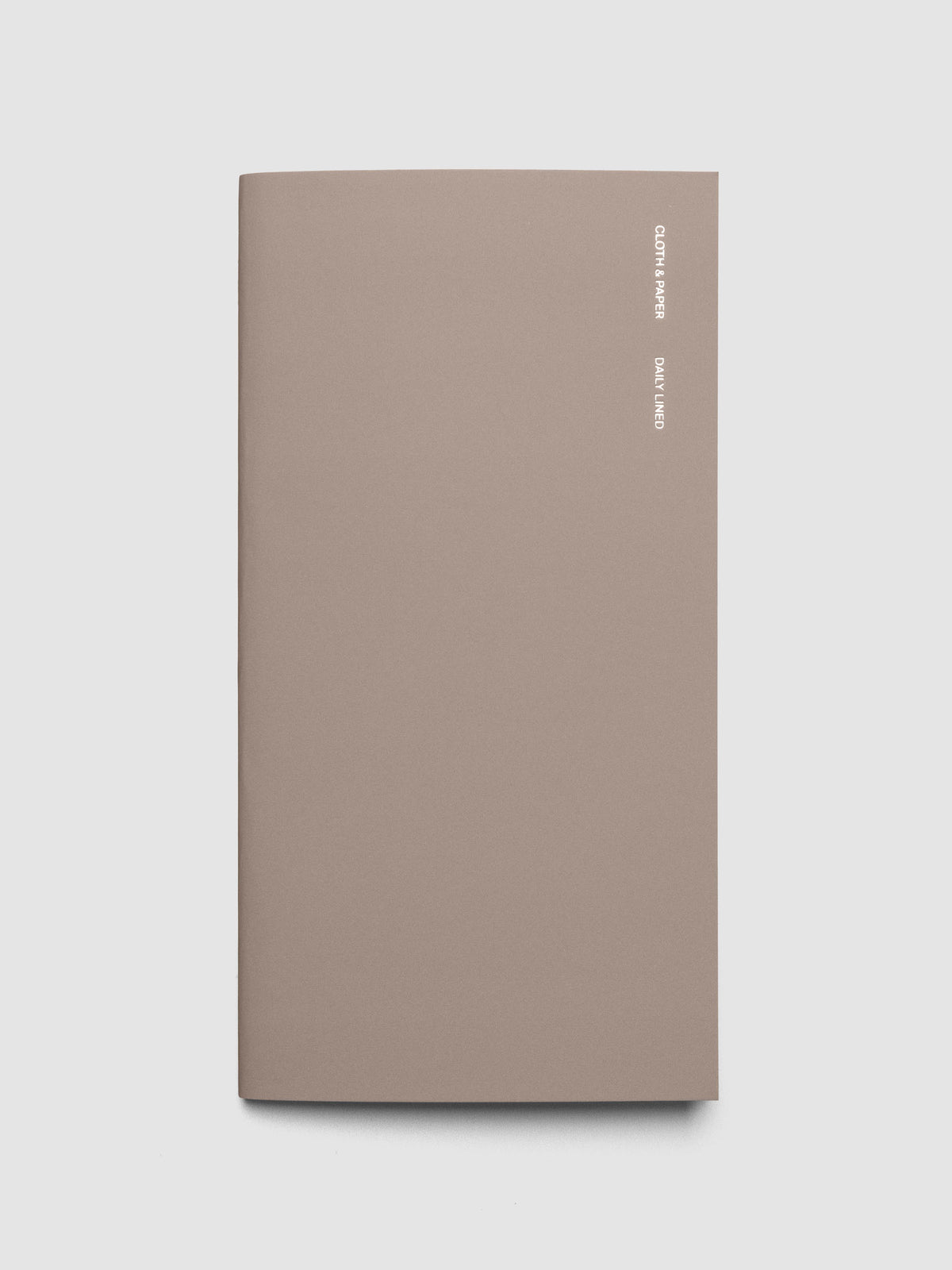 Exterior of a beige a5 slim sized travel notebook.