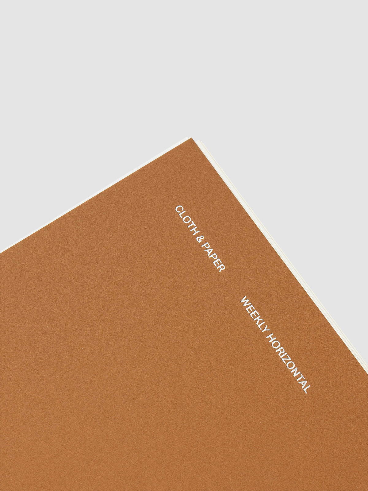 Spiral Notebook in size HP Classic and color Moscow (orange) shown close up displaying cover foil details.