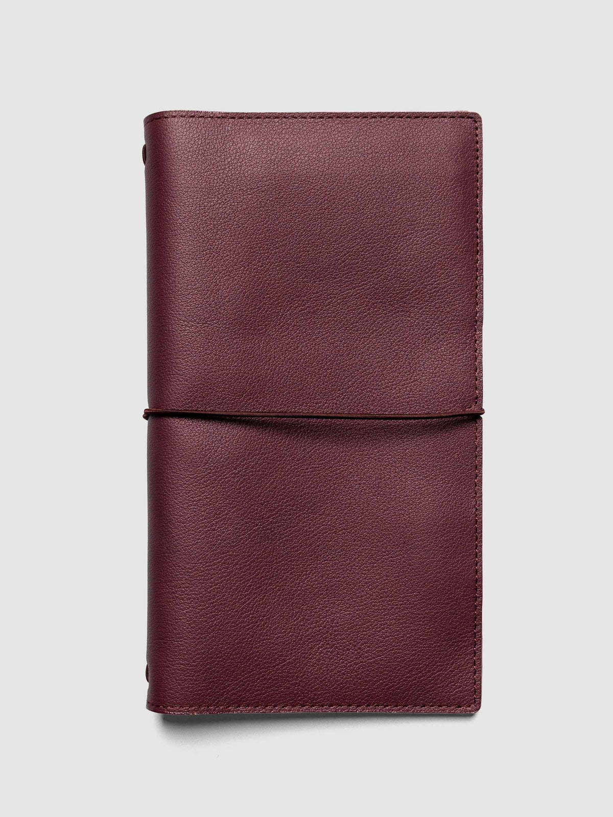 Deep red genuine leather travel notebook cover shown in size A5 Slim.