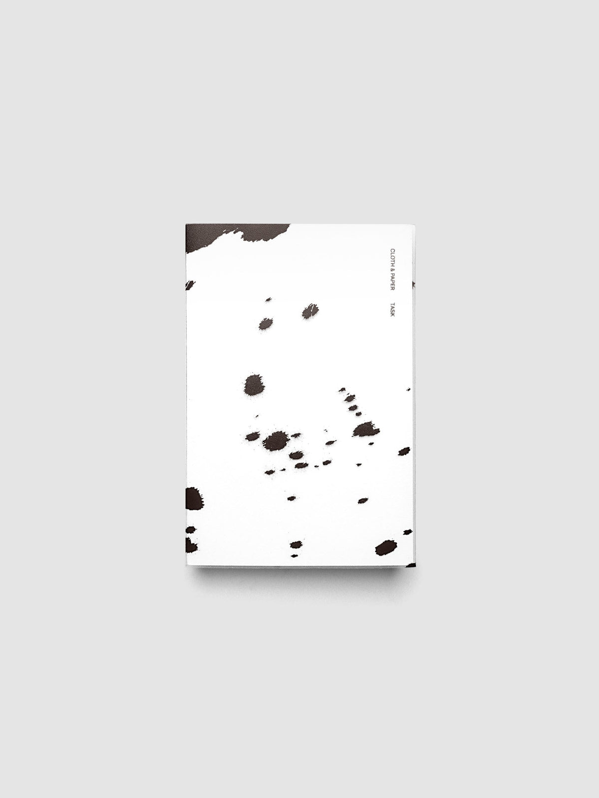 CP Petite frosted plastic notebook cover with brown dalmatian animal print pattern on a Perfect Bound Notebook