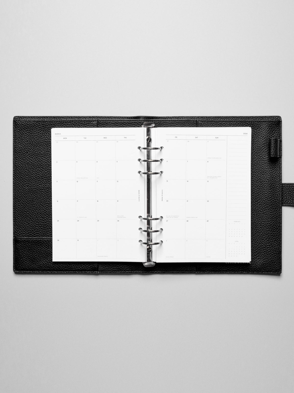 Image shows the Monday Start 2026 Dated Monthly Planner Inserts used in a black leather A5 ring-bound planner.