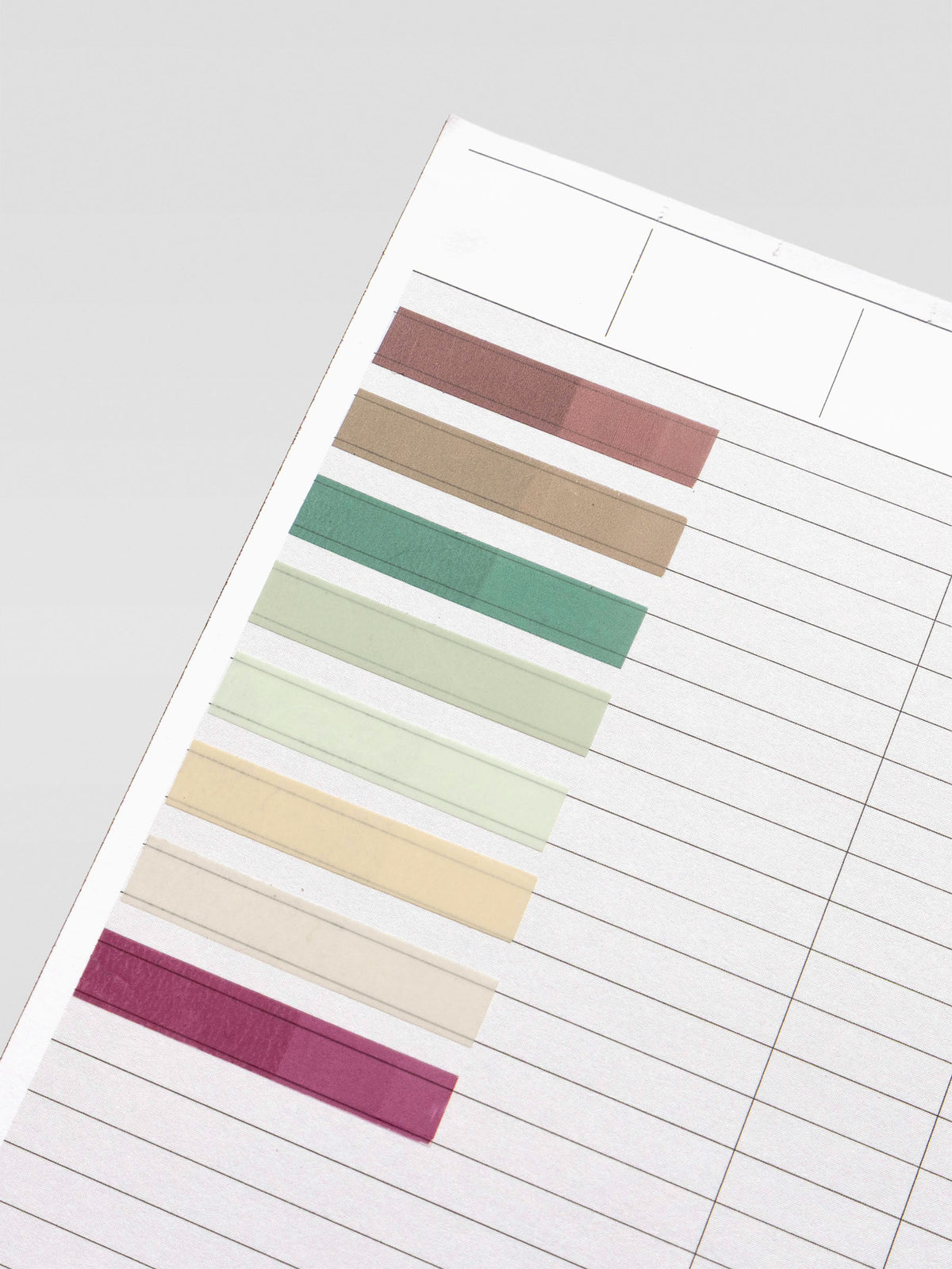 Short page pins in volume 2, a set of 8 page pin solid colors including brown, grey, greens, beige, and red shown individually on paper.