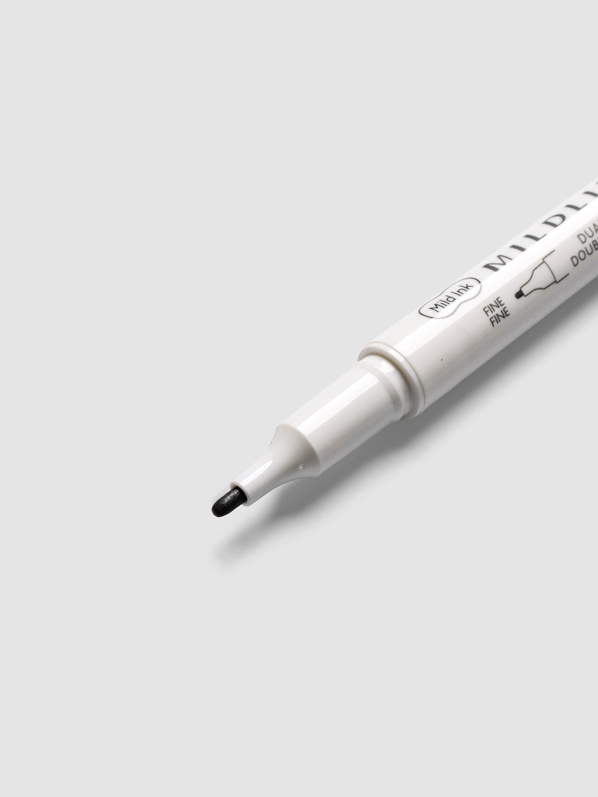 Close-up of Zebra Mildliner Dual-Tip Fineliner fine bullet tip in deep gray