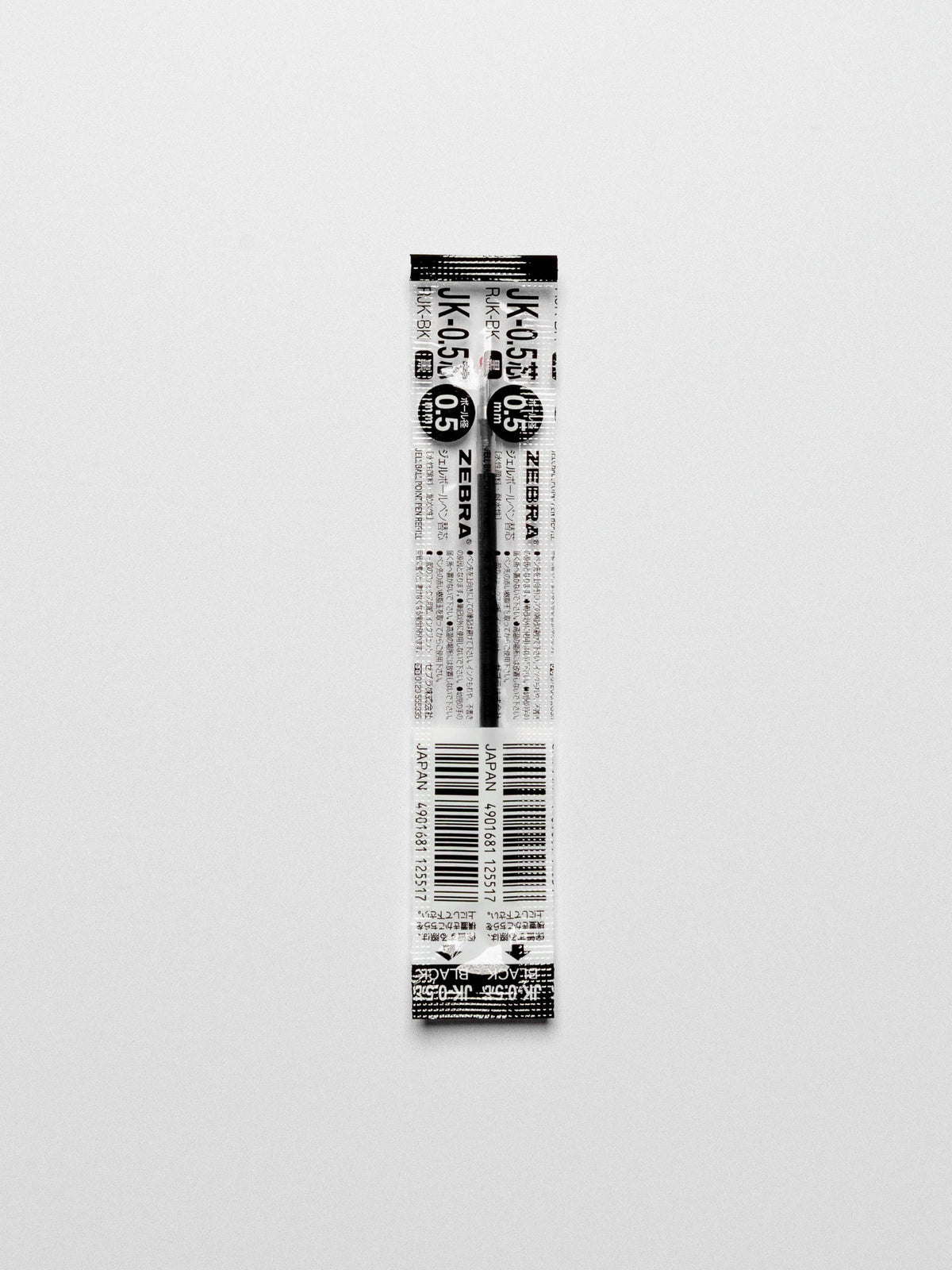 Black 0.5 mm refill shown on a neutral background.