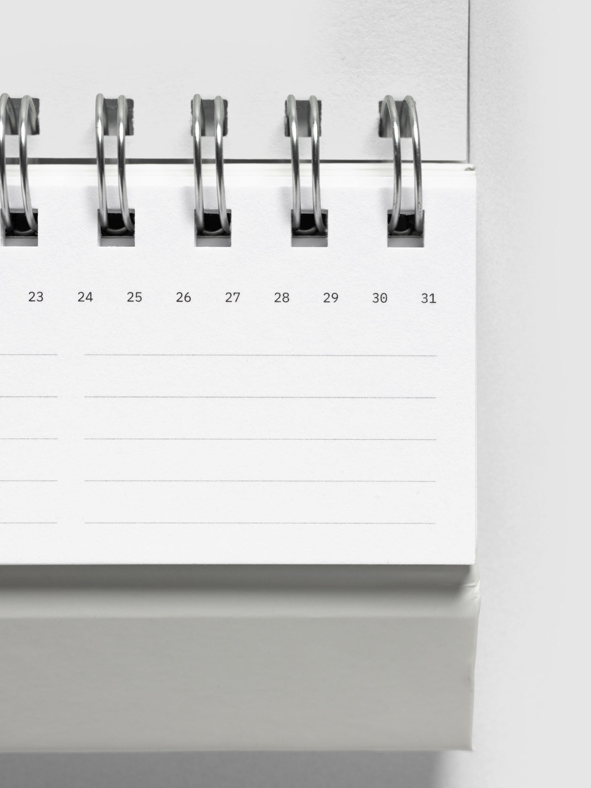 Close up of 2026 Spiral Desk Calendar shown folded and flat, displaying a calendar page.