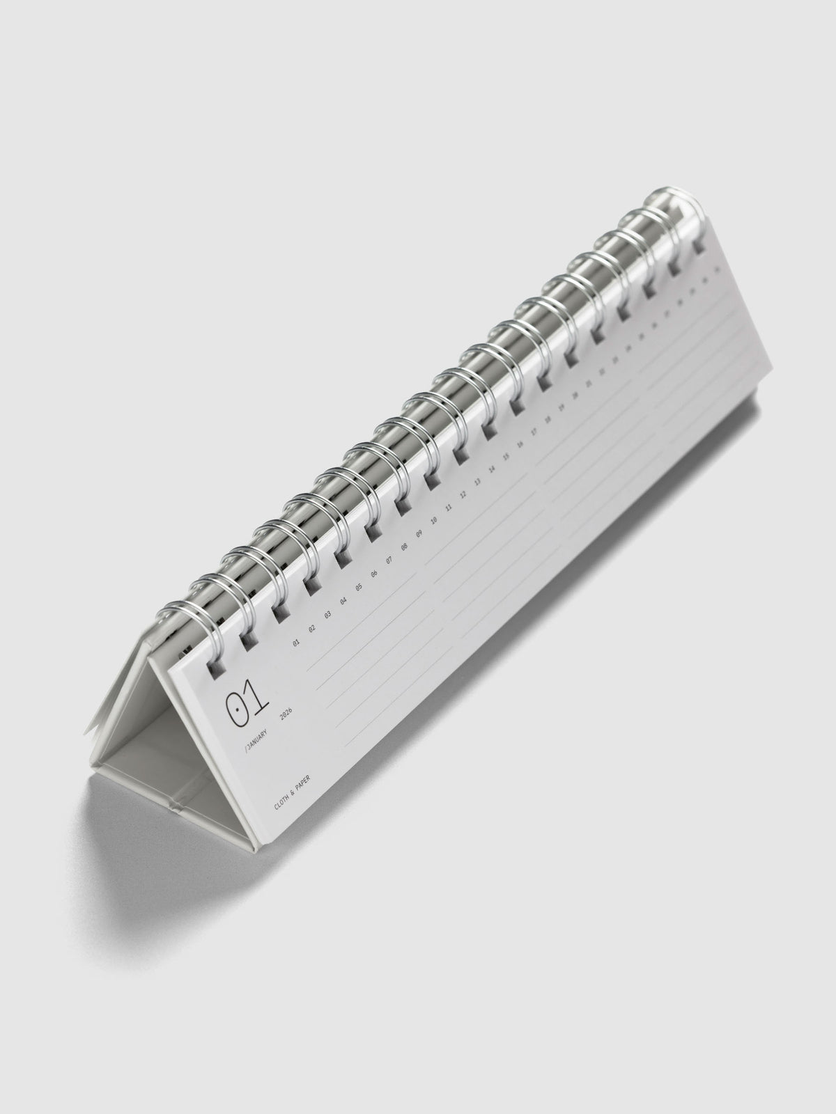 2026 Spiral Desk Calendar shown standing displaying a calendar page.