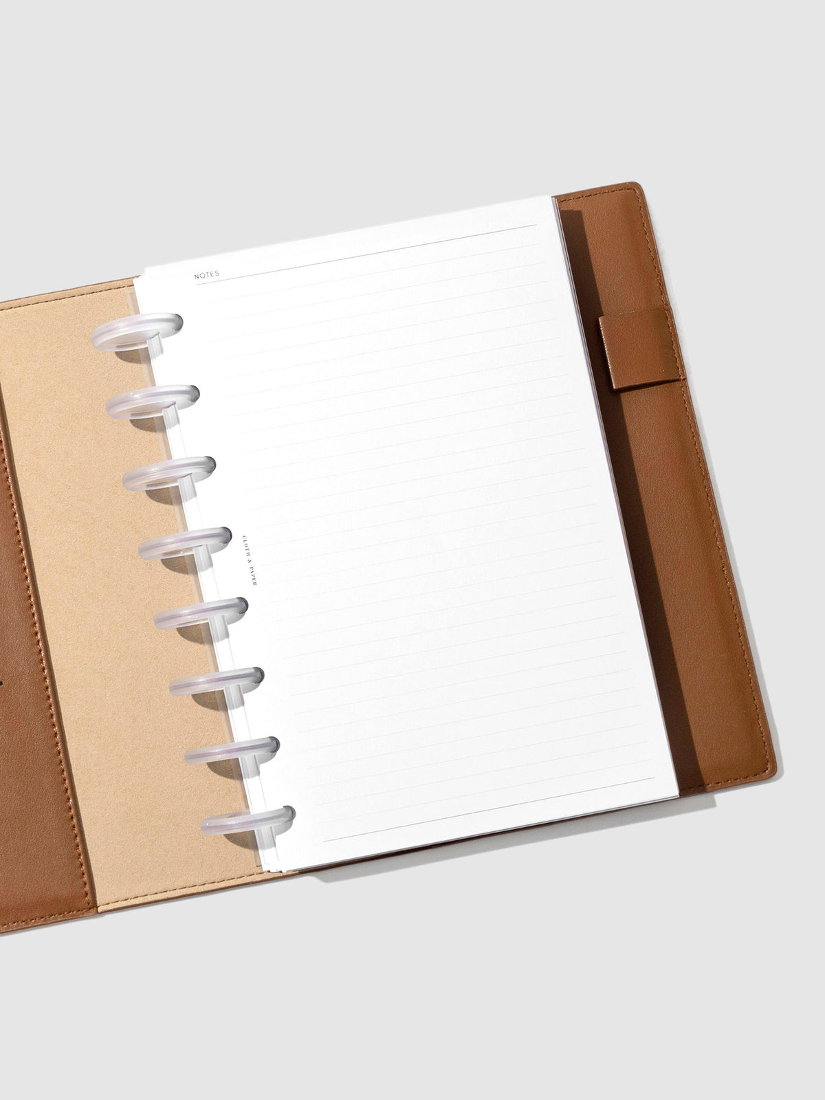 Folio displayed opened on a neutral background. Color shown is clay brown.