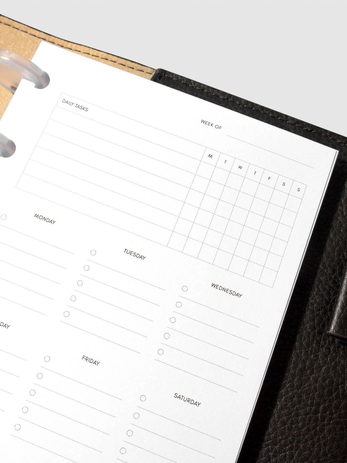 Insert in use inside a black leather planner.