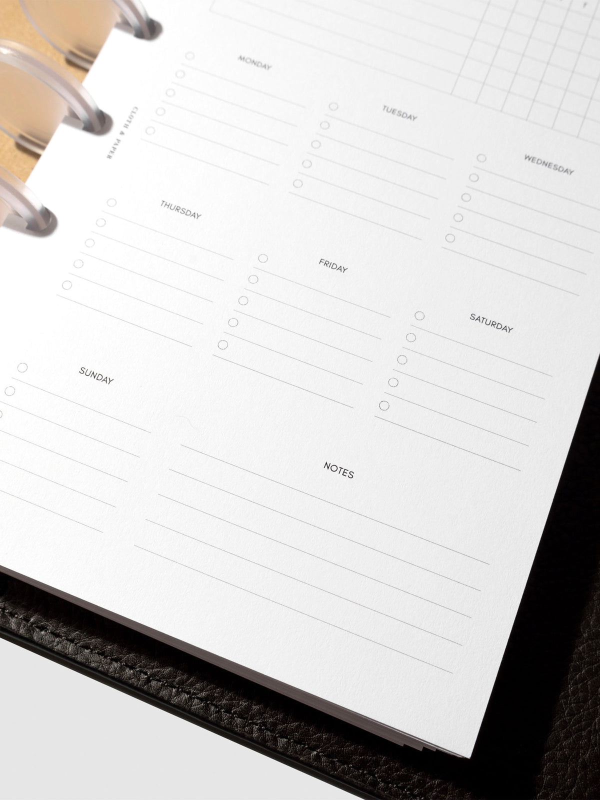 Insert in use inside a black leather planner.