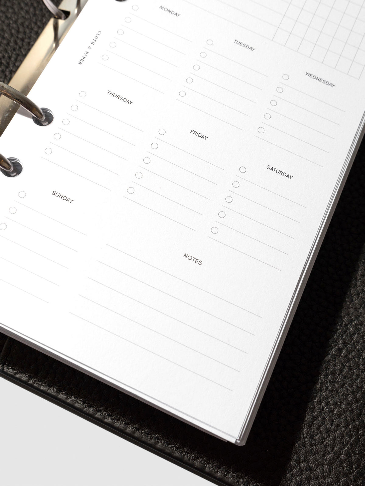 Insert in use inside a black leather planner.