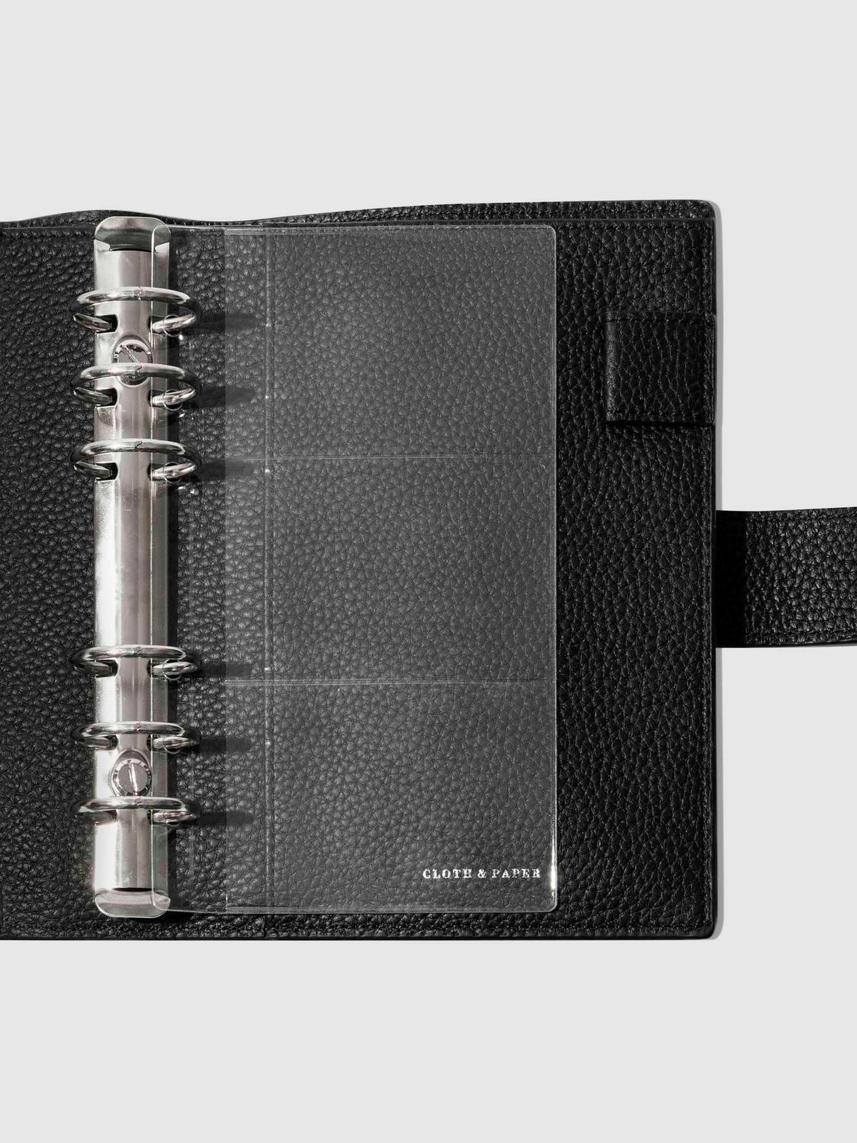 Credit card holders in use inside a black leather folio. Size shown is Personal.