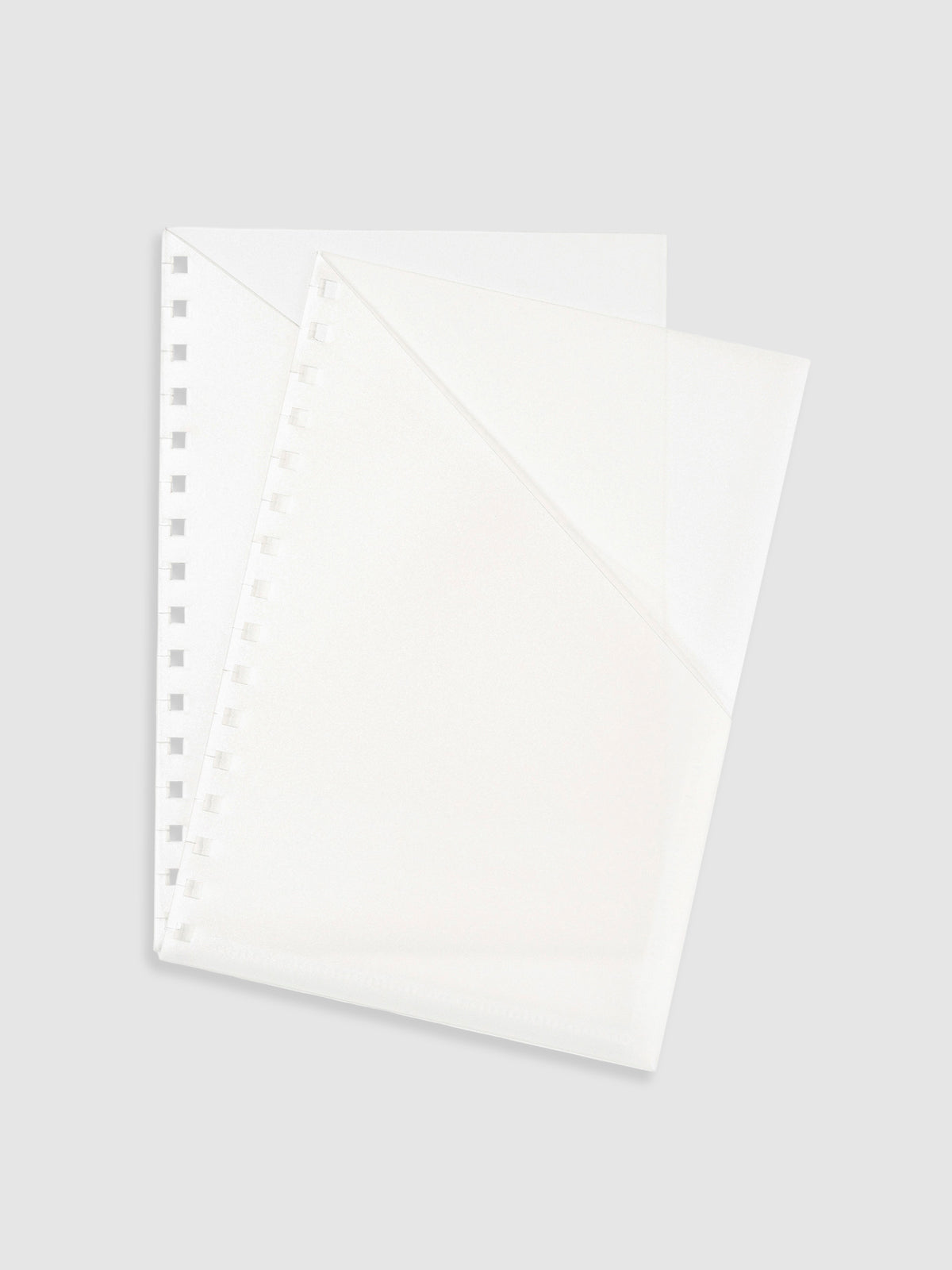 2 A5 Spiral folders layered on top of one another on a neutral background